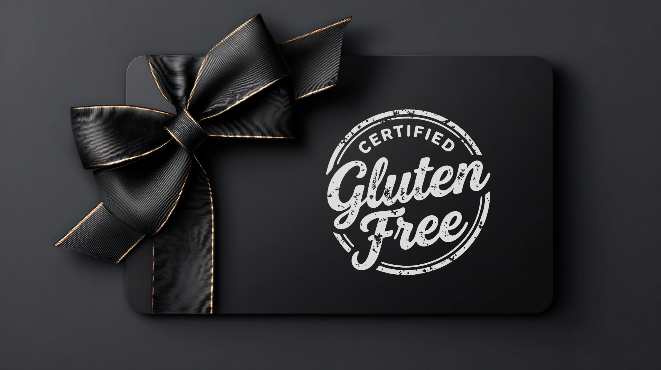 Black gift box with a gold-edged black ribbon bow, featuring a white stamp-style label that reads 'Certified Gluten Free'.