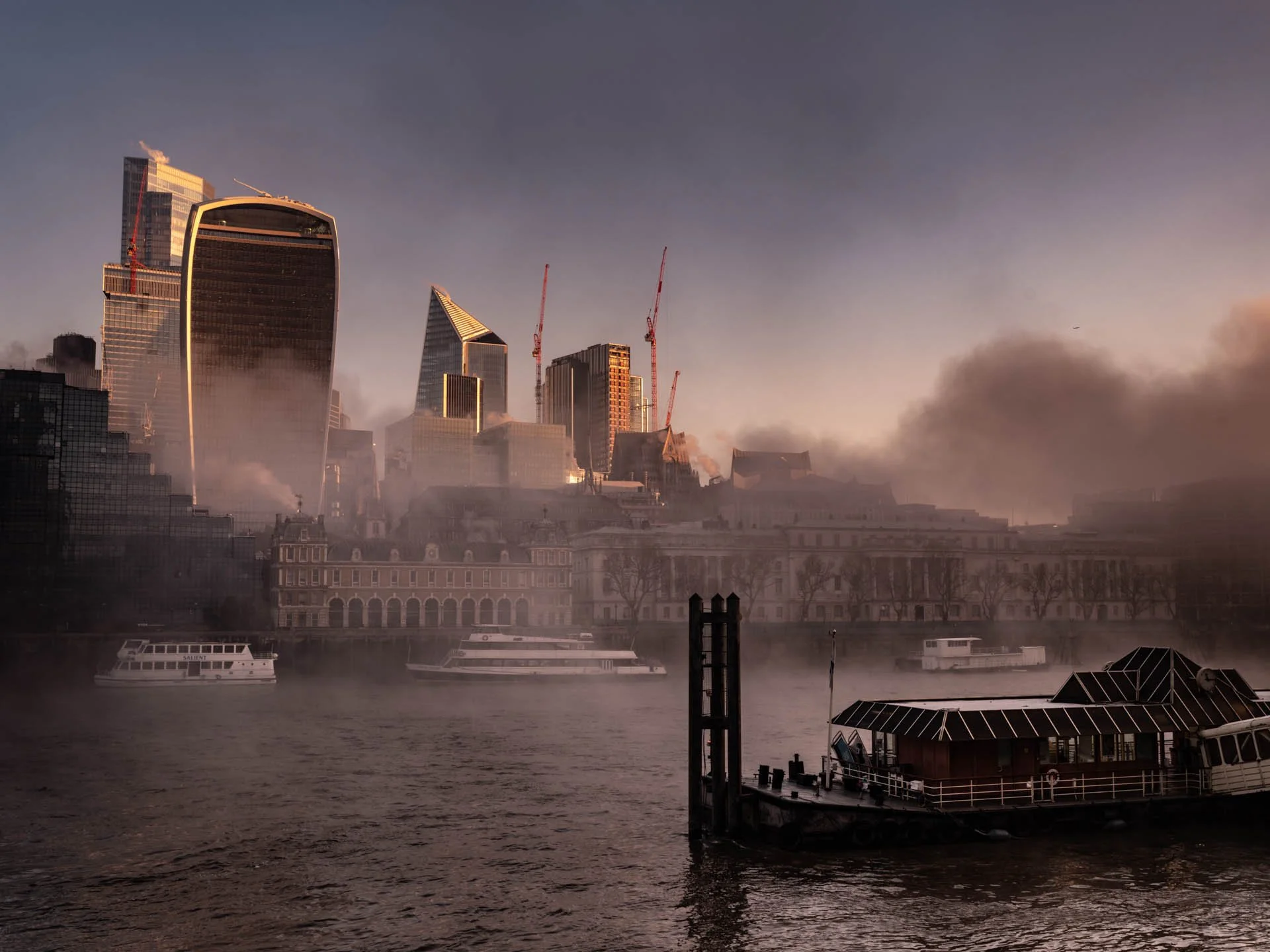 Misty morning fog over the River Thames and London City, London