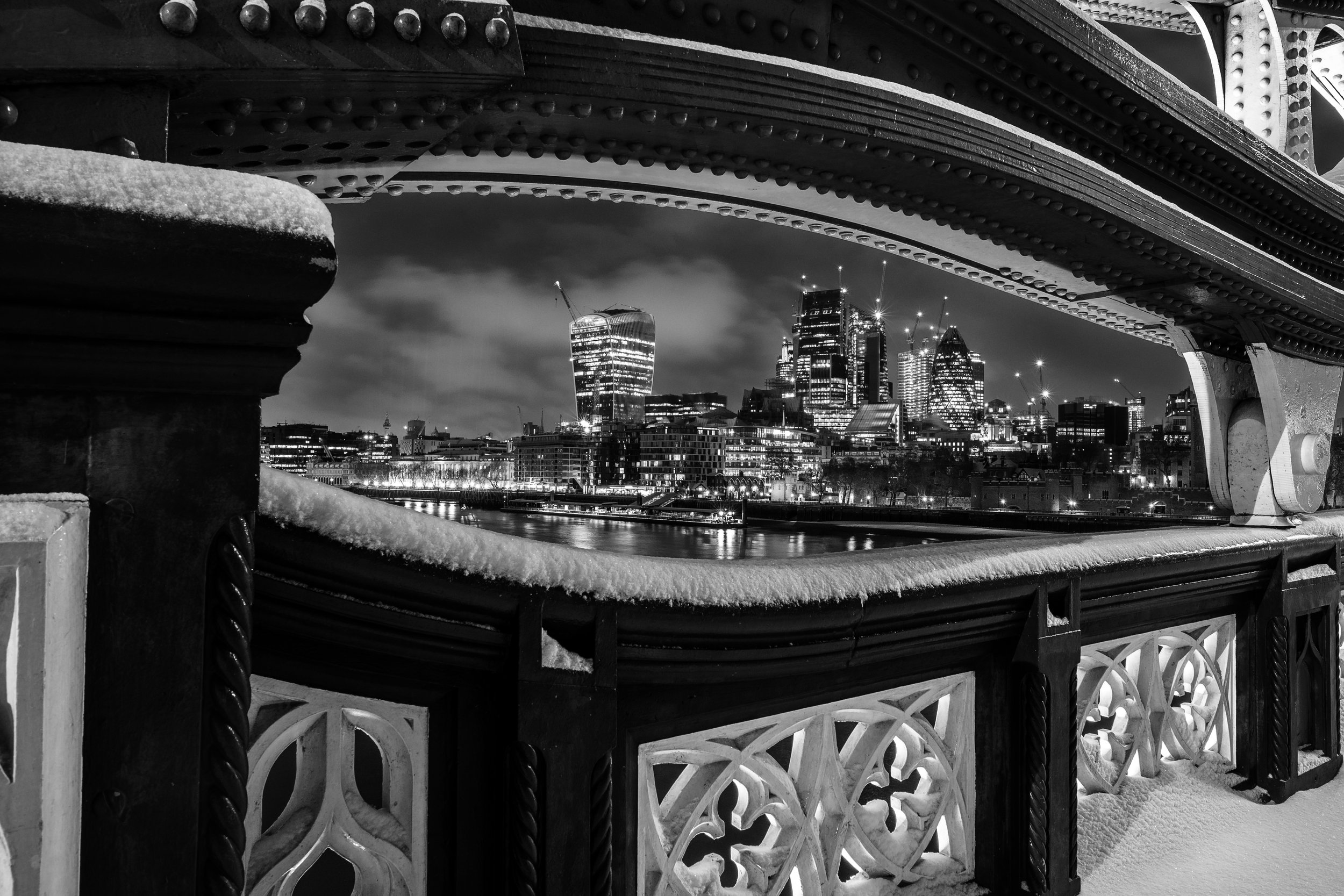Morning snow on Tower Bridge, London framing London city