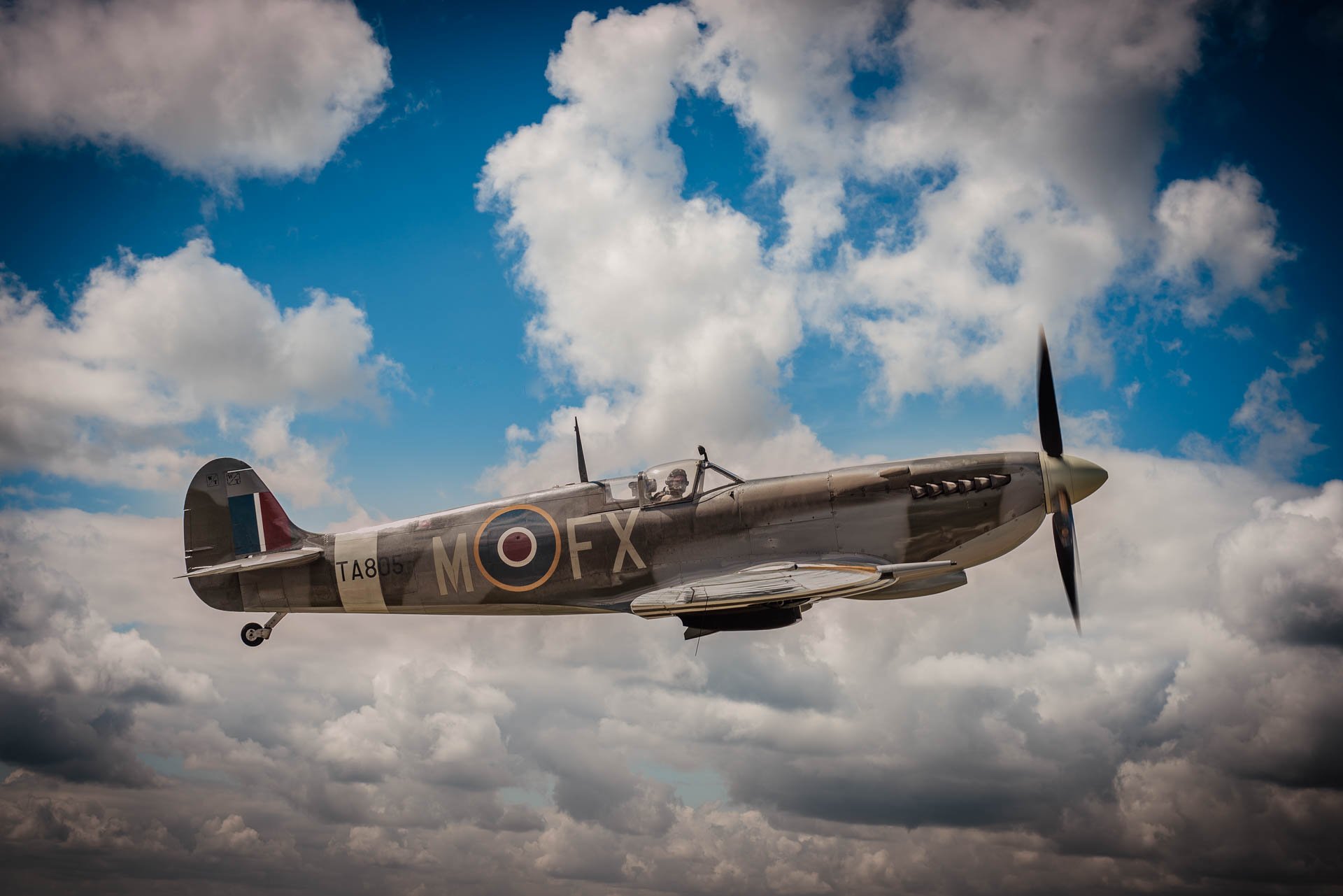 Spitfire Mark 9 taken whilst flying alongside in a Dragon Rapide biplane. This was the image that I used in  a limited edition framed print run, all signed by myself and  Geoffrey Wellum, DFC, the youngest Spitfire pilot in The Battle Of Britain.n