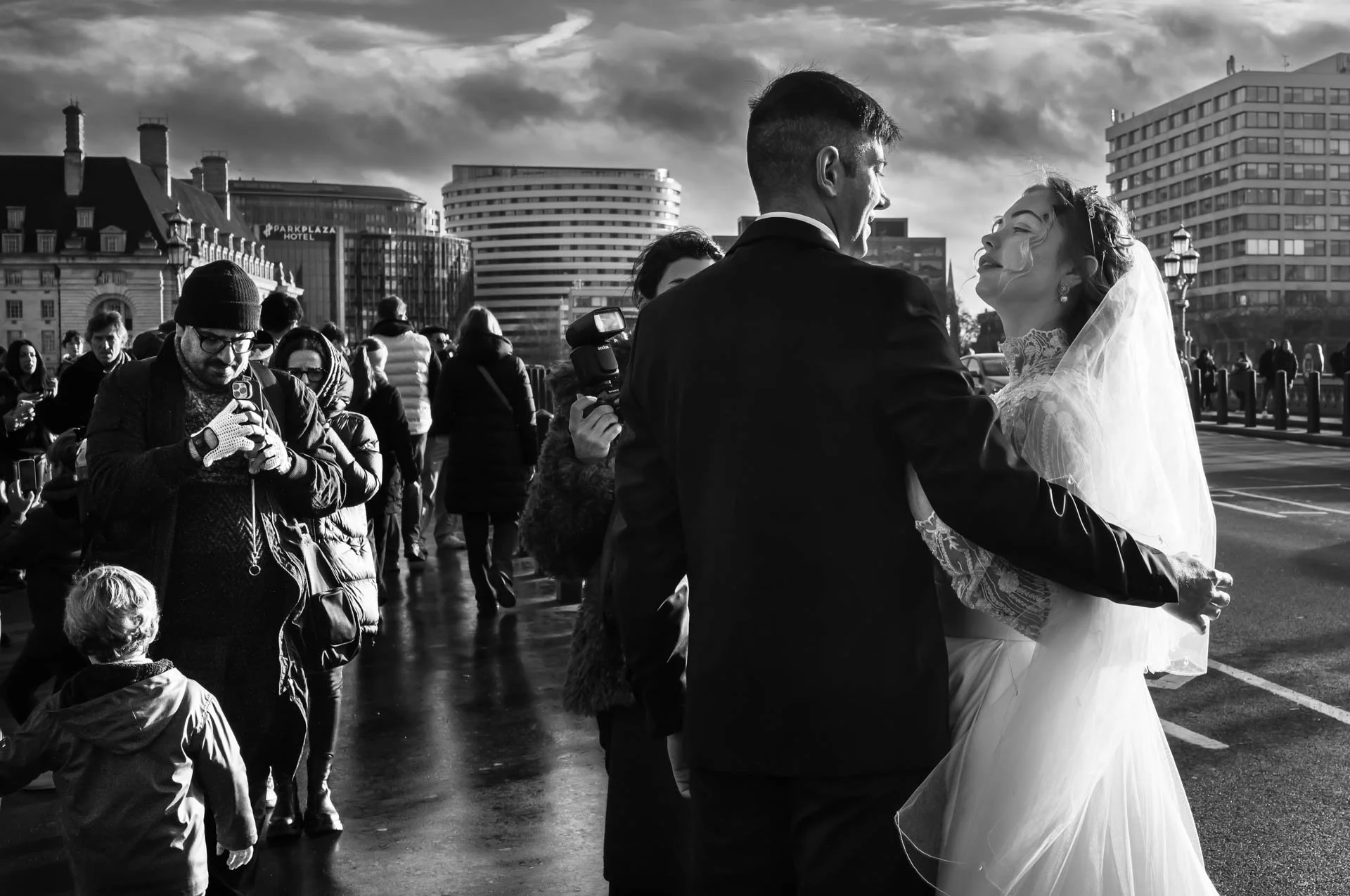 I took this one morning as I was walking across Westminster Bridge, London. It is a quick candid of a bride and groom posing for a photographer. Taken with my Leica M11 Monochrome and APO 35mm Summicron lens.