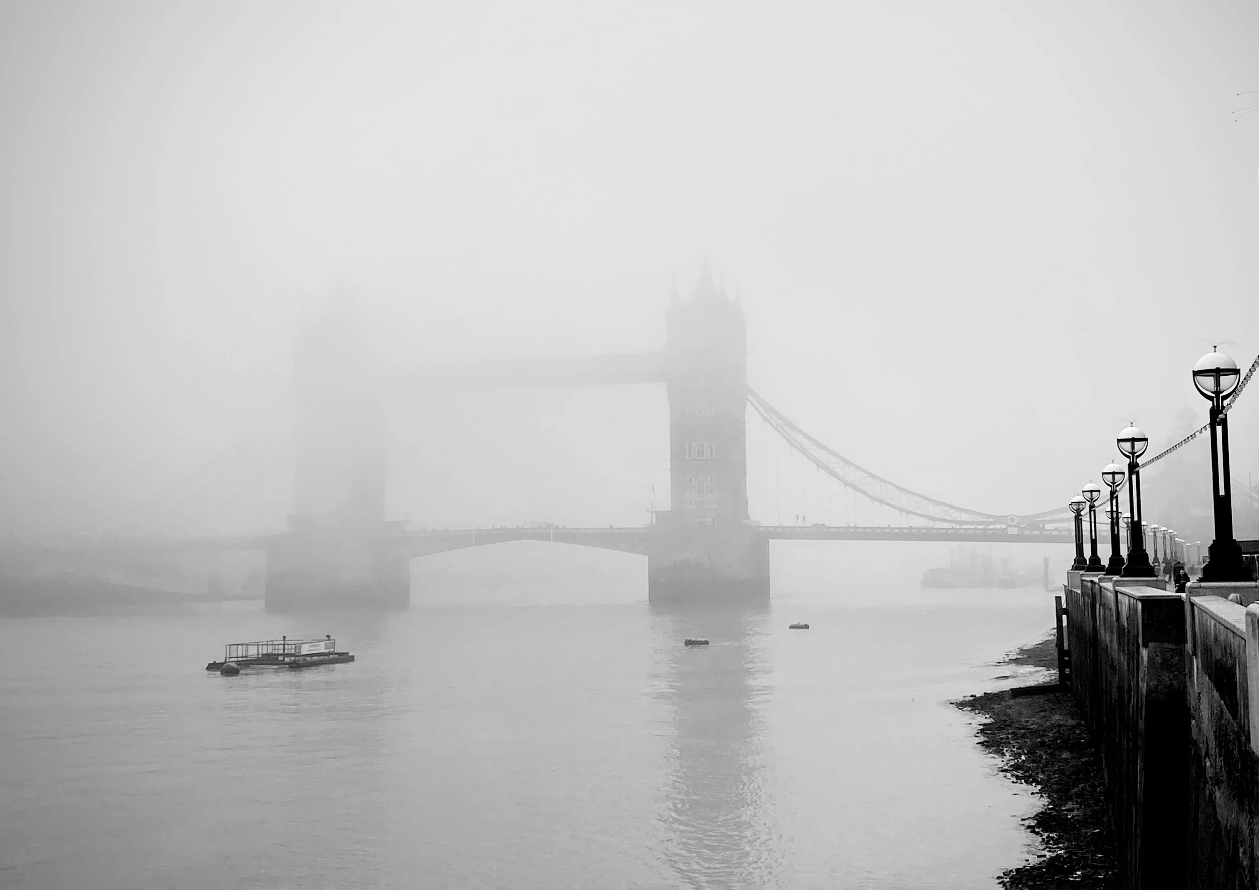 Black and white foggy morning over Toer Bridge, London