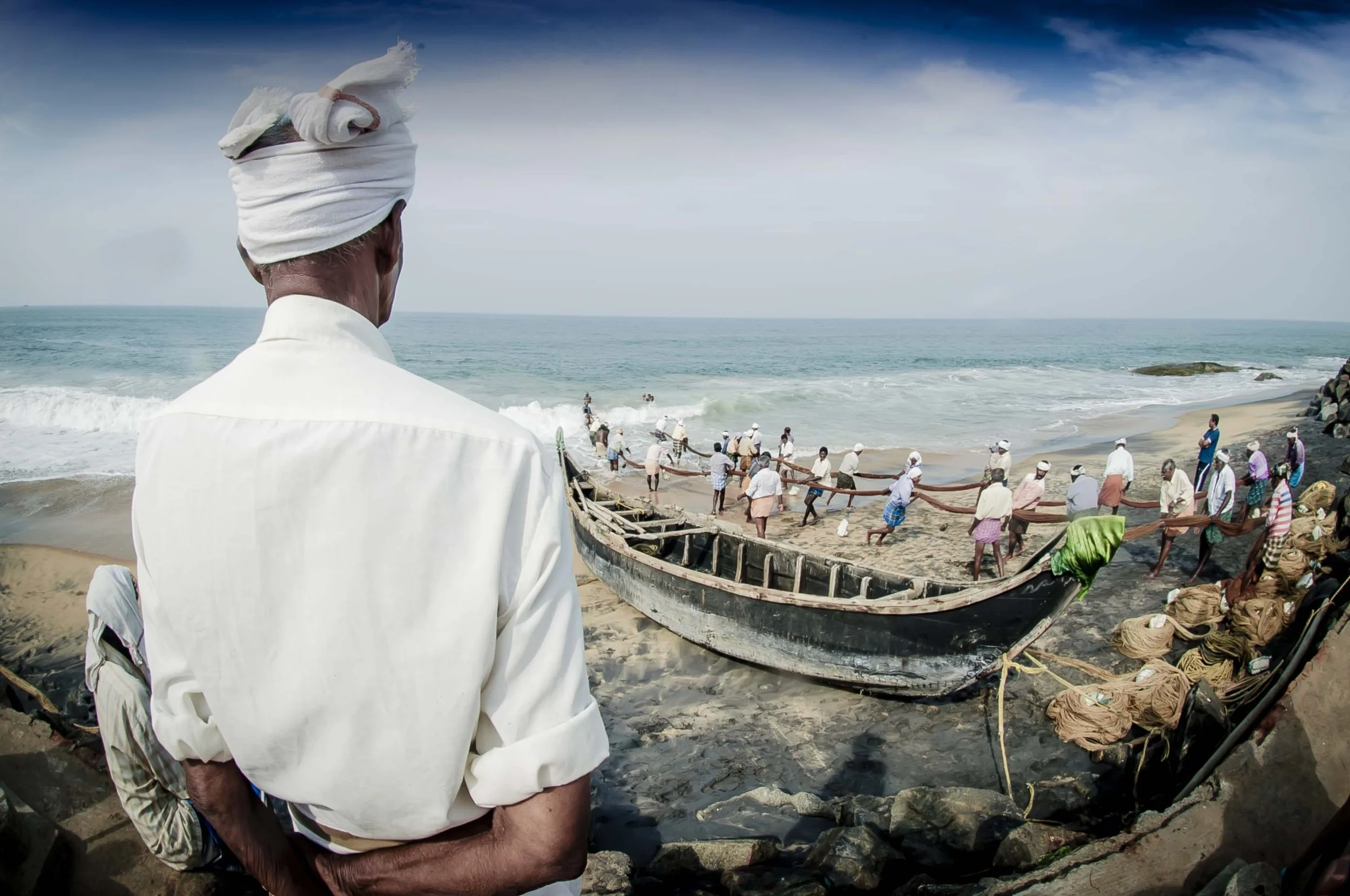Wide angle, fish eye lens used to capture fishermen and boats at Vizhinjam International Seaport Thiruvananthapuram