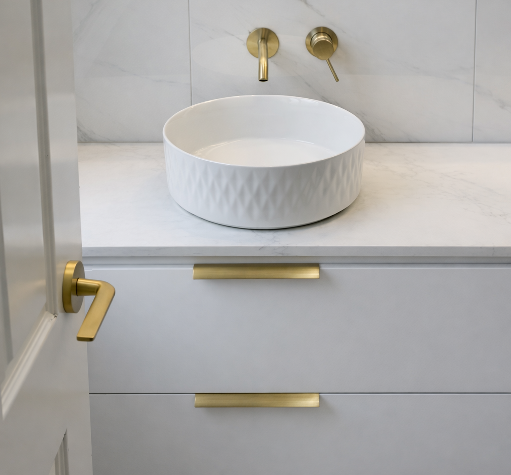 Bathroom vanity installation by Graziani Tiling & Renovations (GTR Renovations) in Perth, featuring a round vessel basin, brass tapware, marble countertop, and precision tiling.