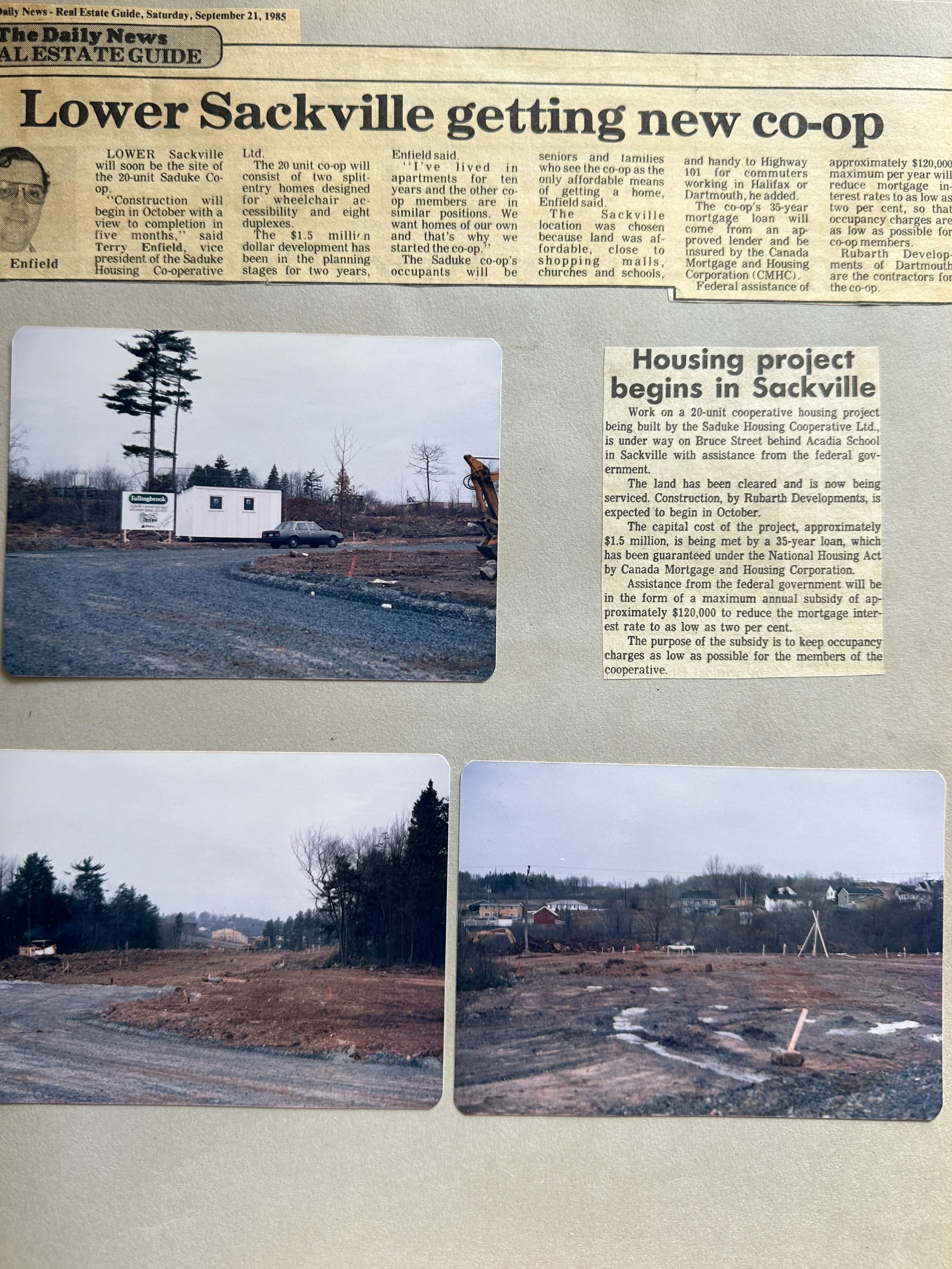 Newspaper article from the September 21, 1985 edition of The Daily News about a housing project in Sackville, including three photographs of an empty construction site with some trees, a temporary office trailer, and the beginning of land clearing.