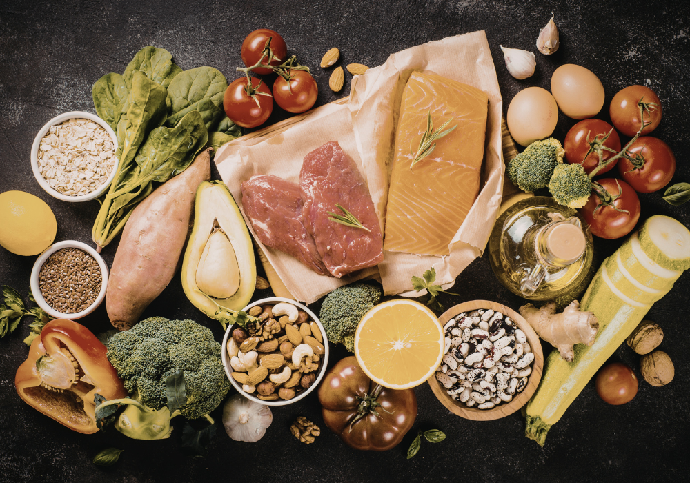 This image shows many of the foods that are beneficial for postpartum healing and recovery, and perfect to include in any postpartum meal prep.