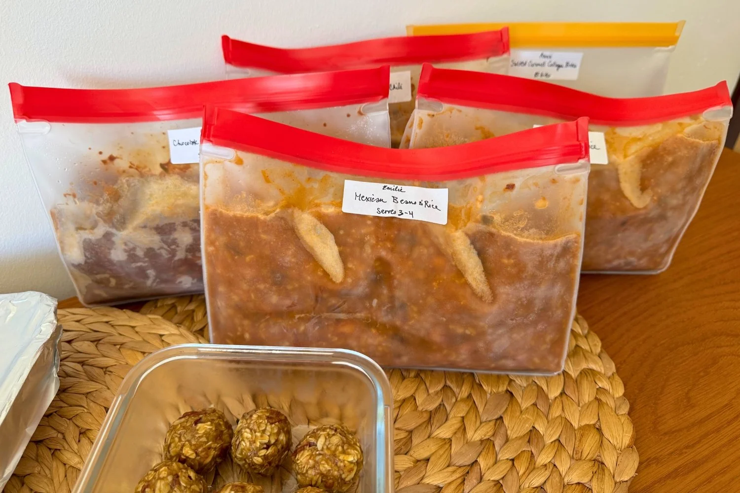 Labelled frozen postpartum meals, lasagna and energy balls prepared for delivery in Lisbon