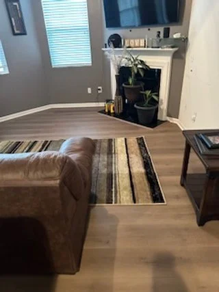 photo of a newly completed luxury vinyl plank floor installation by Providence Hardwood Flooring