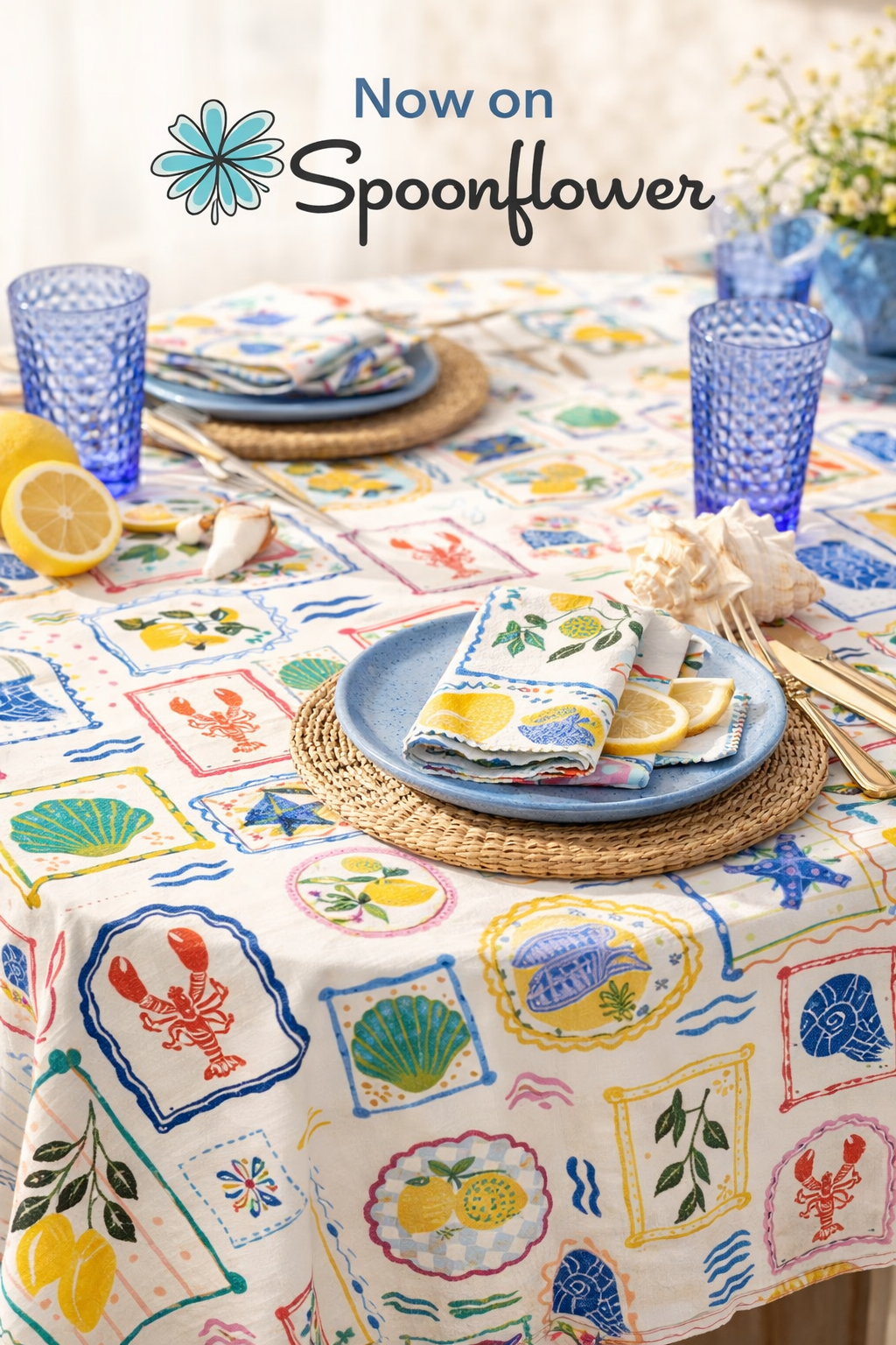 Colorful seaside themed table setting with blue plates, lemon slices, seashells, and nautical-themed napkins on a patterned tablecloth featuring marine illustrations and bright colors. Surface Pattern Design Collections for fabric and wallpaper.