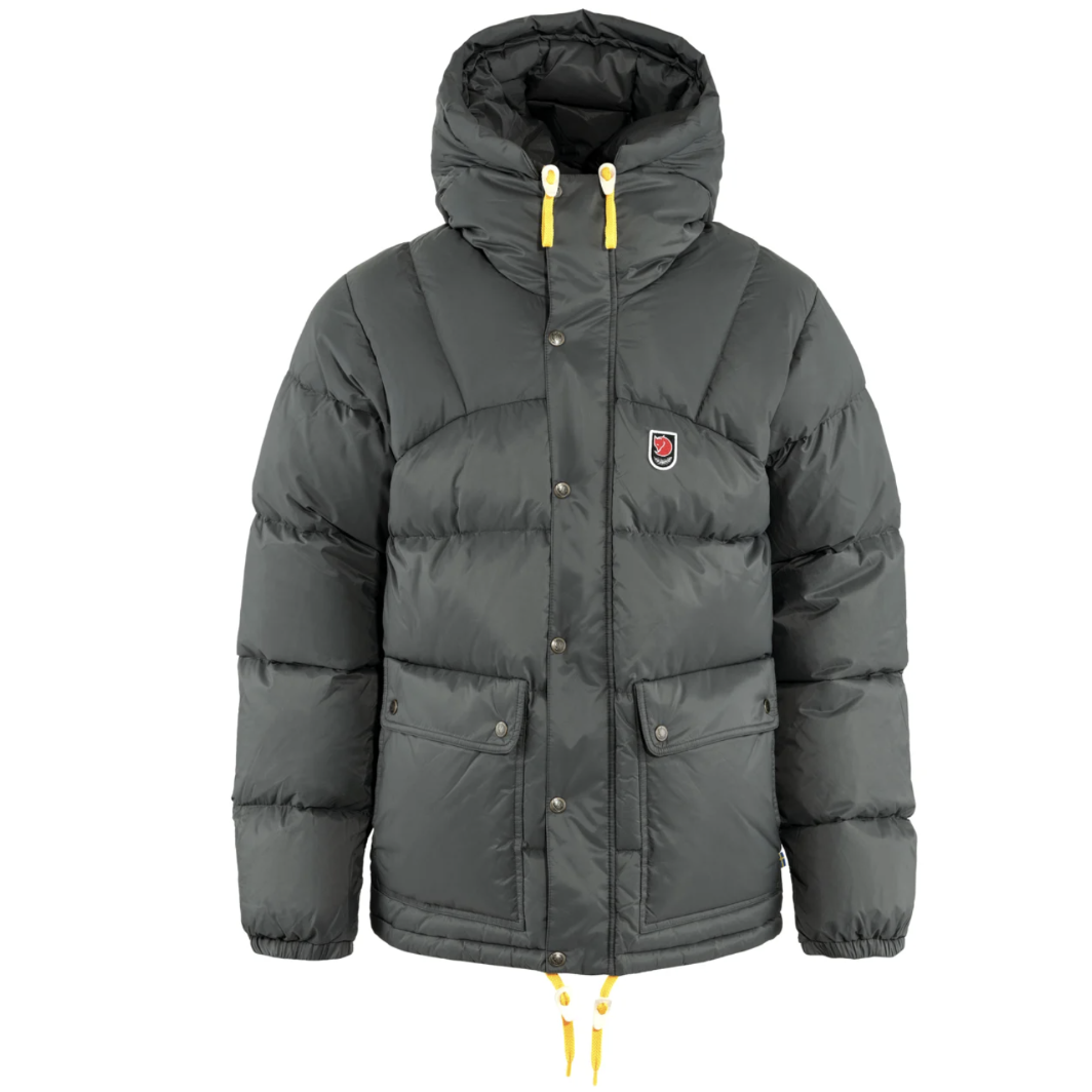 Fjällräven — Expedition Down Lite Jacket
A lighter take on the iconic original, with ethically sourced down and stitch-through construction suited to mild winter climates. Synthetic shoulder padding resists moisture and compression from packs.