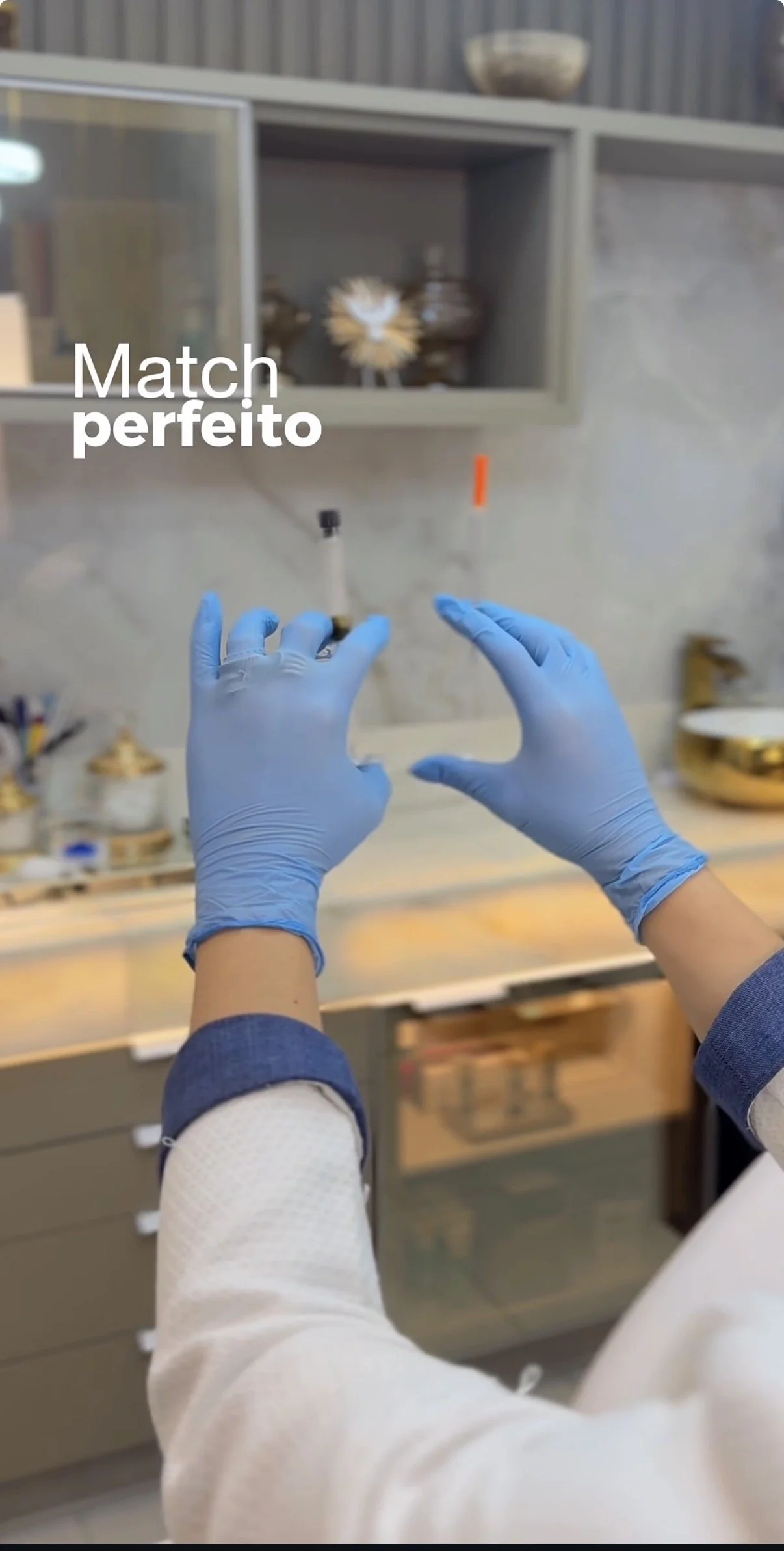 Person wearing blue gloves handling laboratory equipment in a lab setting.