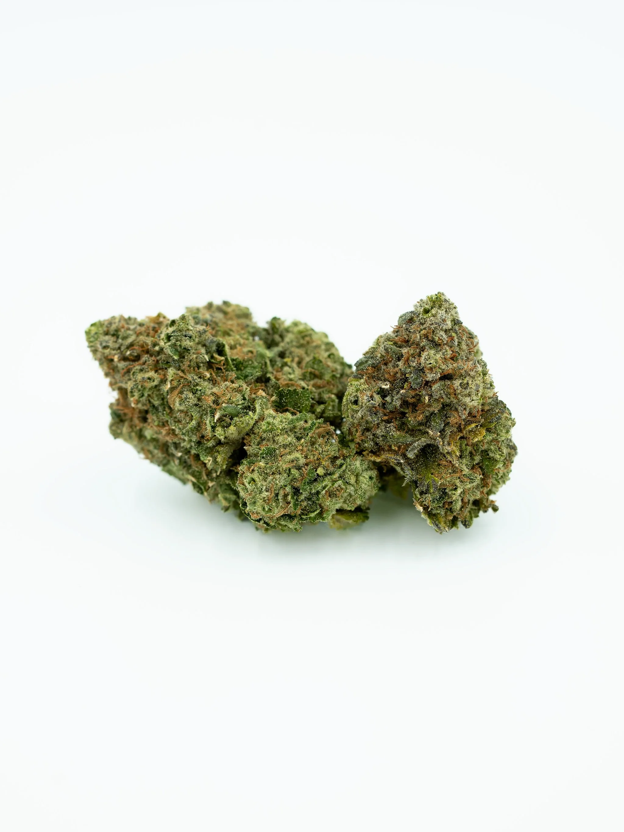 Close-up image of two cannabis buds on a white background.
