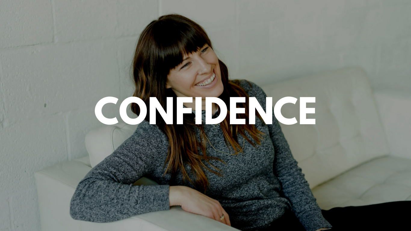 A woman sitting on a white couch, smiling and leaning back with one arm resting on the armrest, with the word 'CONFIDENCE' overlayed.