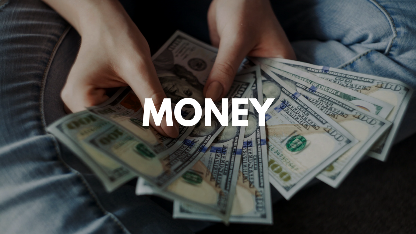 Person holding multiple $100 bills with the word 'MONEY' written across the image.