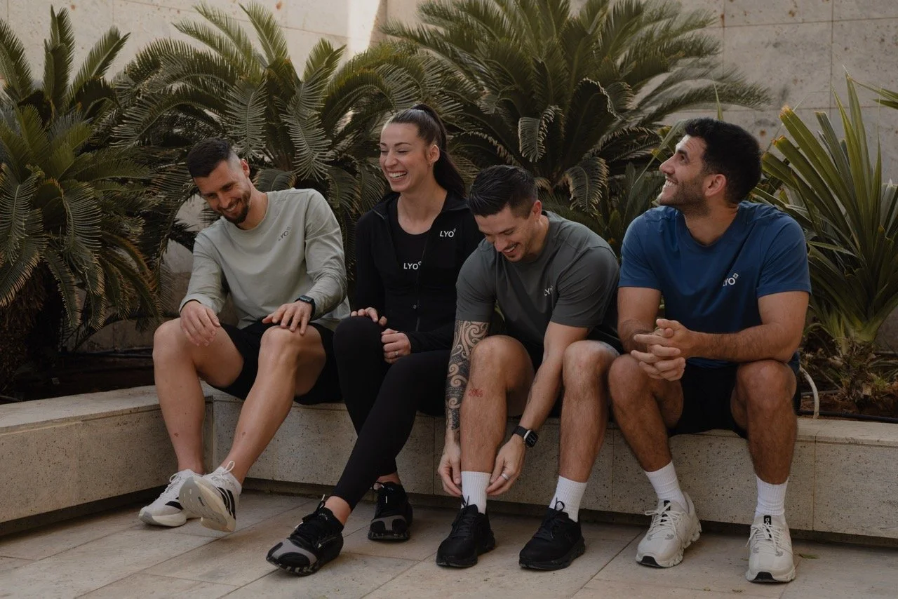 Two women train together at an outdoor gym