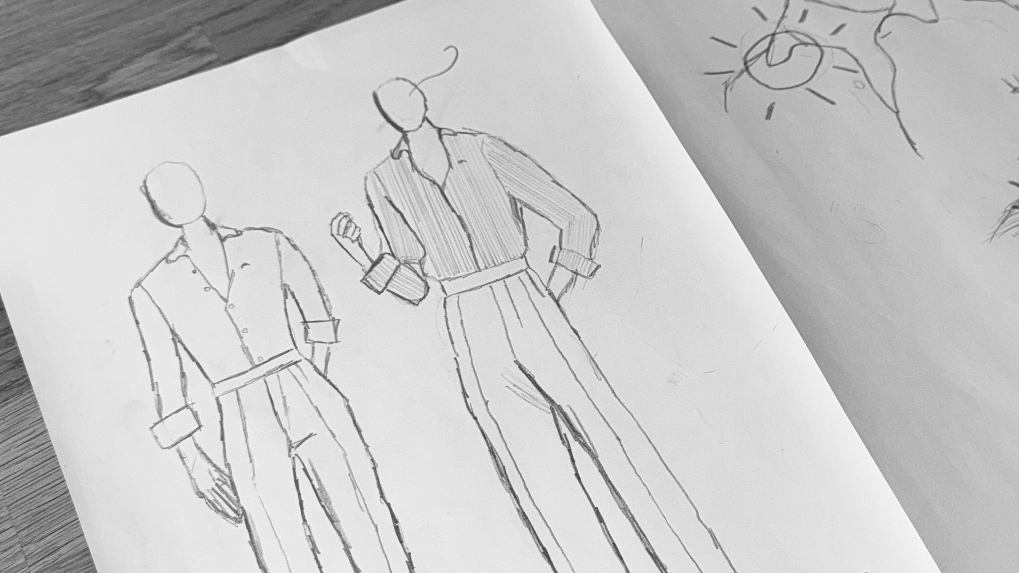 Sketch of two faceless figures in vintage style bespoke outfits, one with a hand on their hip and the other with a hand clenched in a fist.