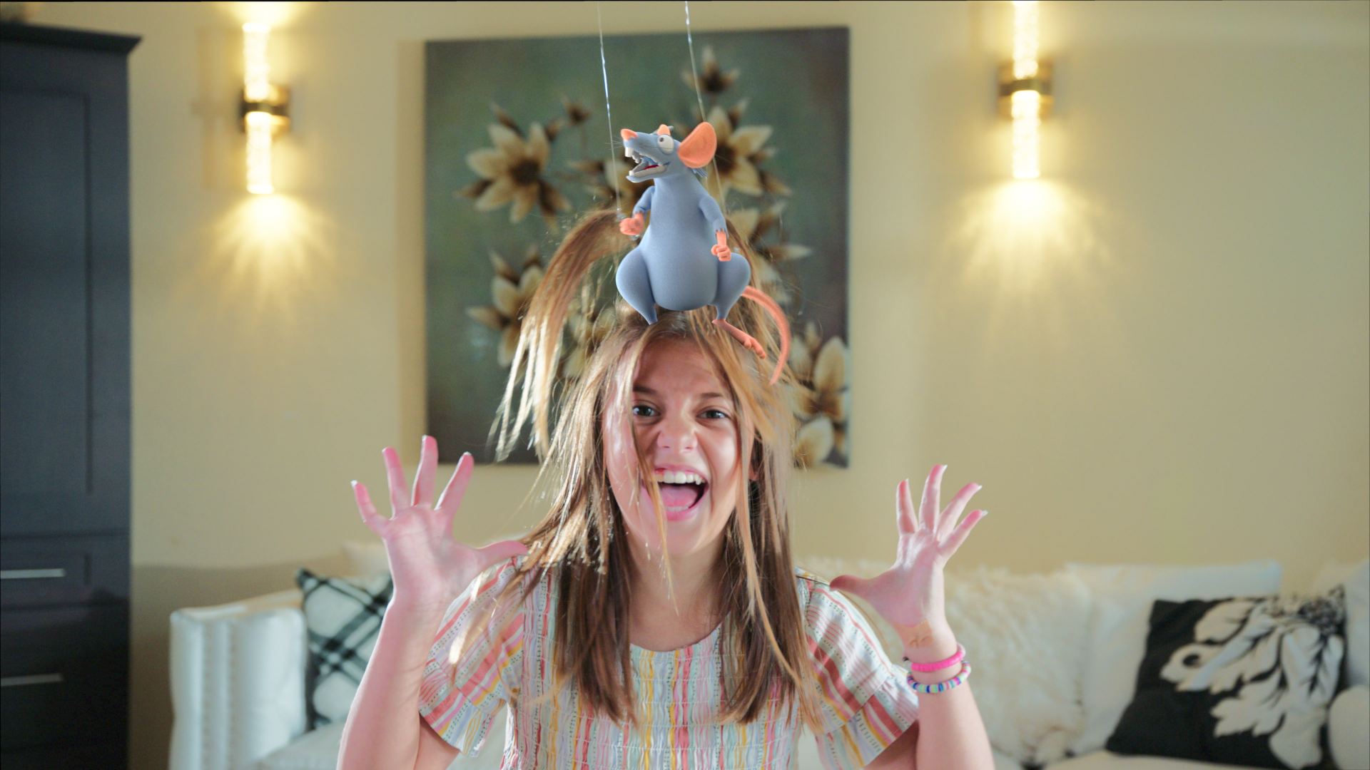 A rough composite job with temporary lighting placing our character onto the actresses head