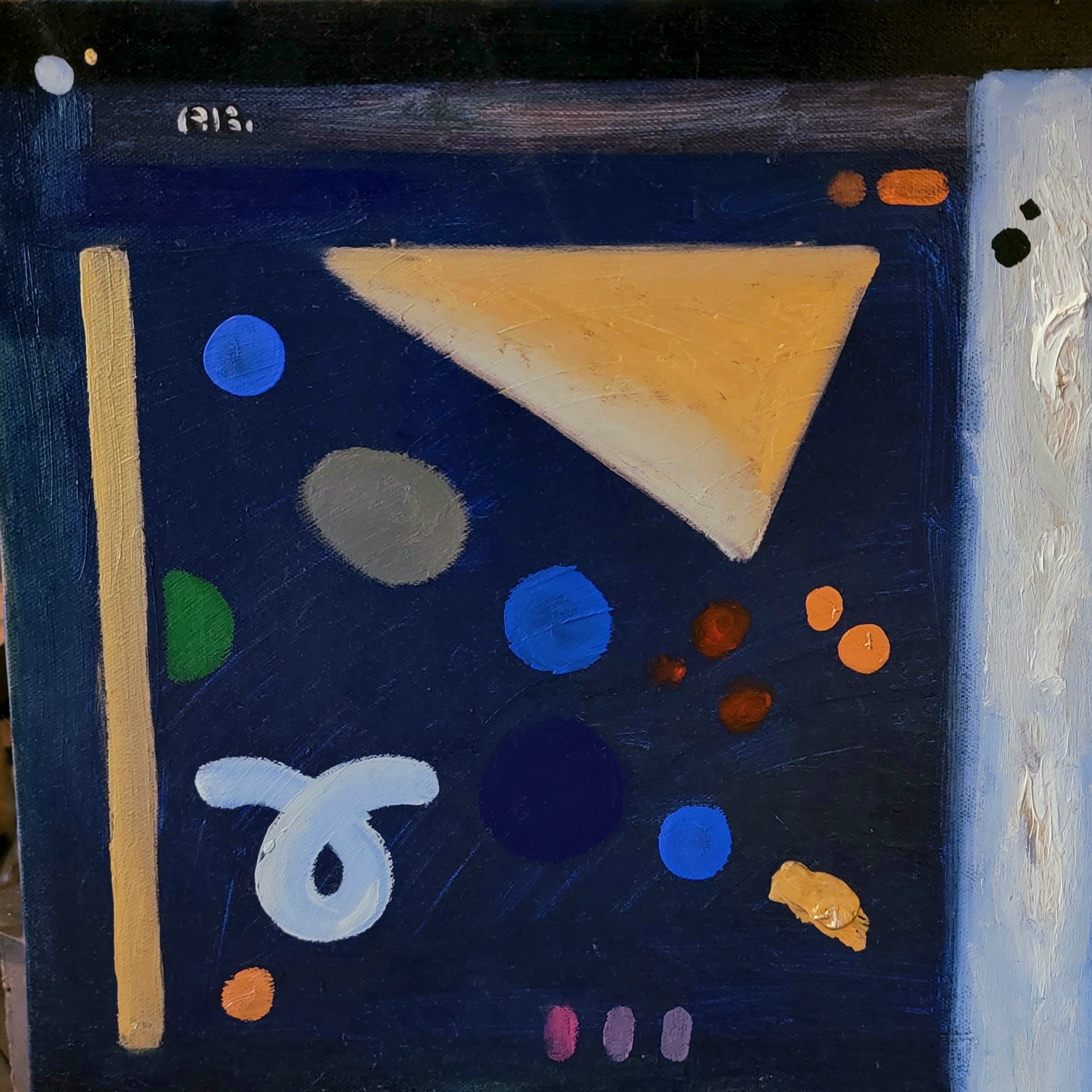 Abstract painting with various geometric shapes on a dark blue background, including a prominent yellowish triangle, circles in blue, gray, green, and orange, and some textured white and orange patches.