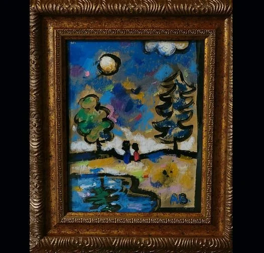Colorful landscape painting with two figures standing by a water body, trees, a sun or moon in the sky, and clouds, framed in an ornate wooden frame.