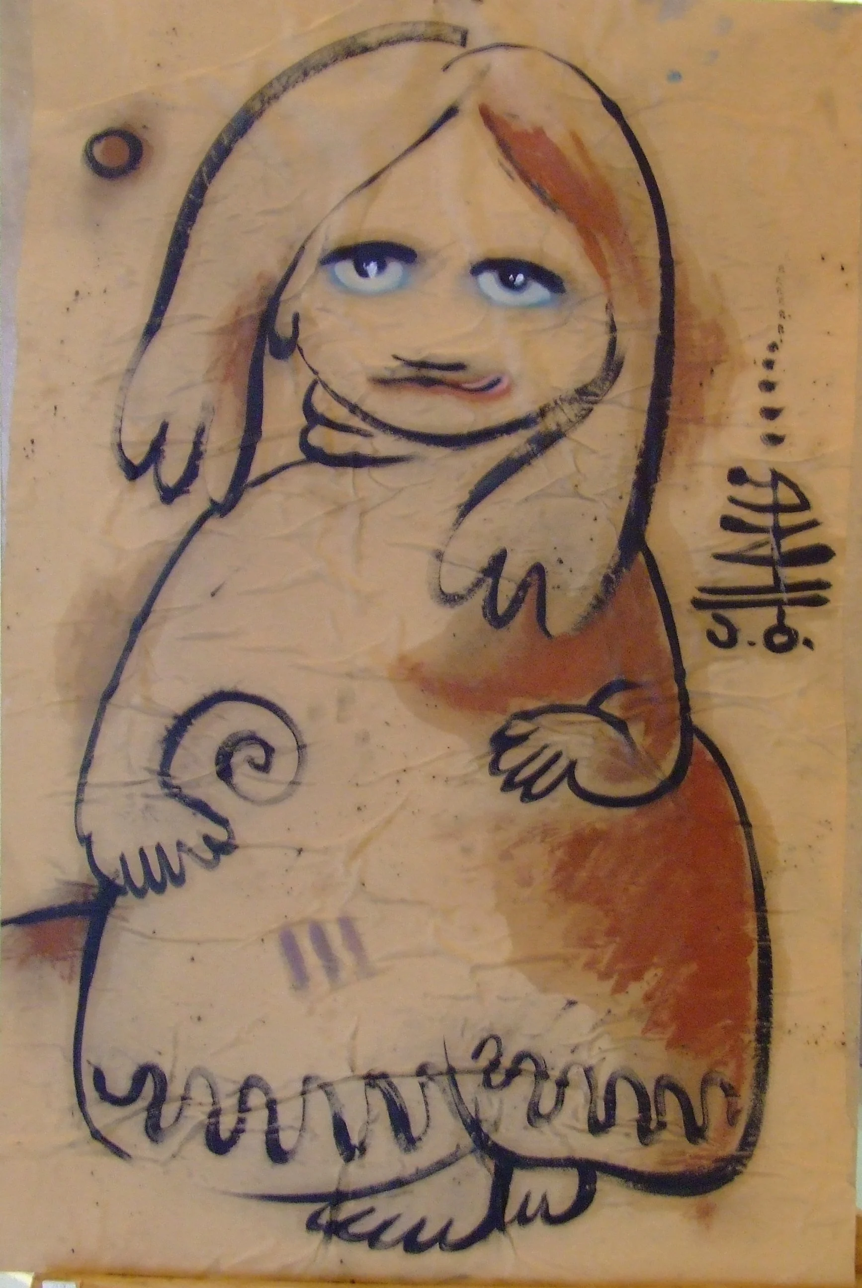 Graffiti drawing of a cartoon girl with long hair and blue eyes, with added realistic facial features, on a weathered wooden surface.