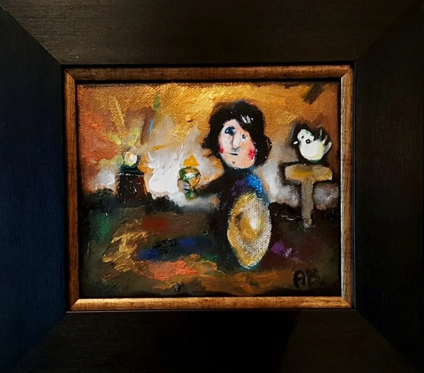 A colorful painting of a woman with dark curly hair, a bird on a table, and various objects with a warm background, framed in black.