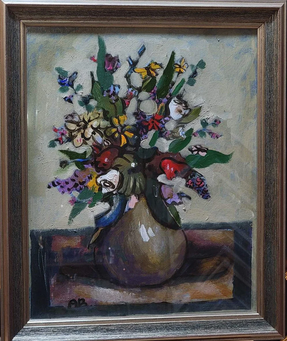 An oil painting of a colorful bouquet of flowers in a round vase on a table, signed with initials 'OB' in the bottom left corner.