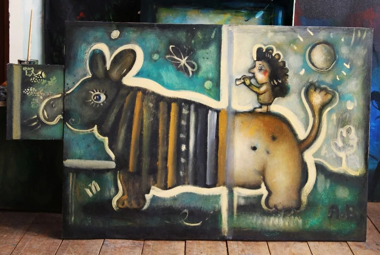 A colorful abstract painting features a large, stylized animal with a rabbit and a lion's body divided into two halves. On the right side, a girl with curly hair sits on the animal's back, blowing a horn. The background includes celestial elements li