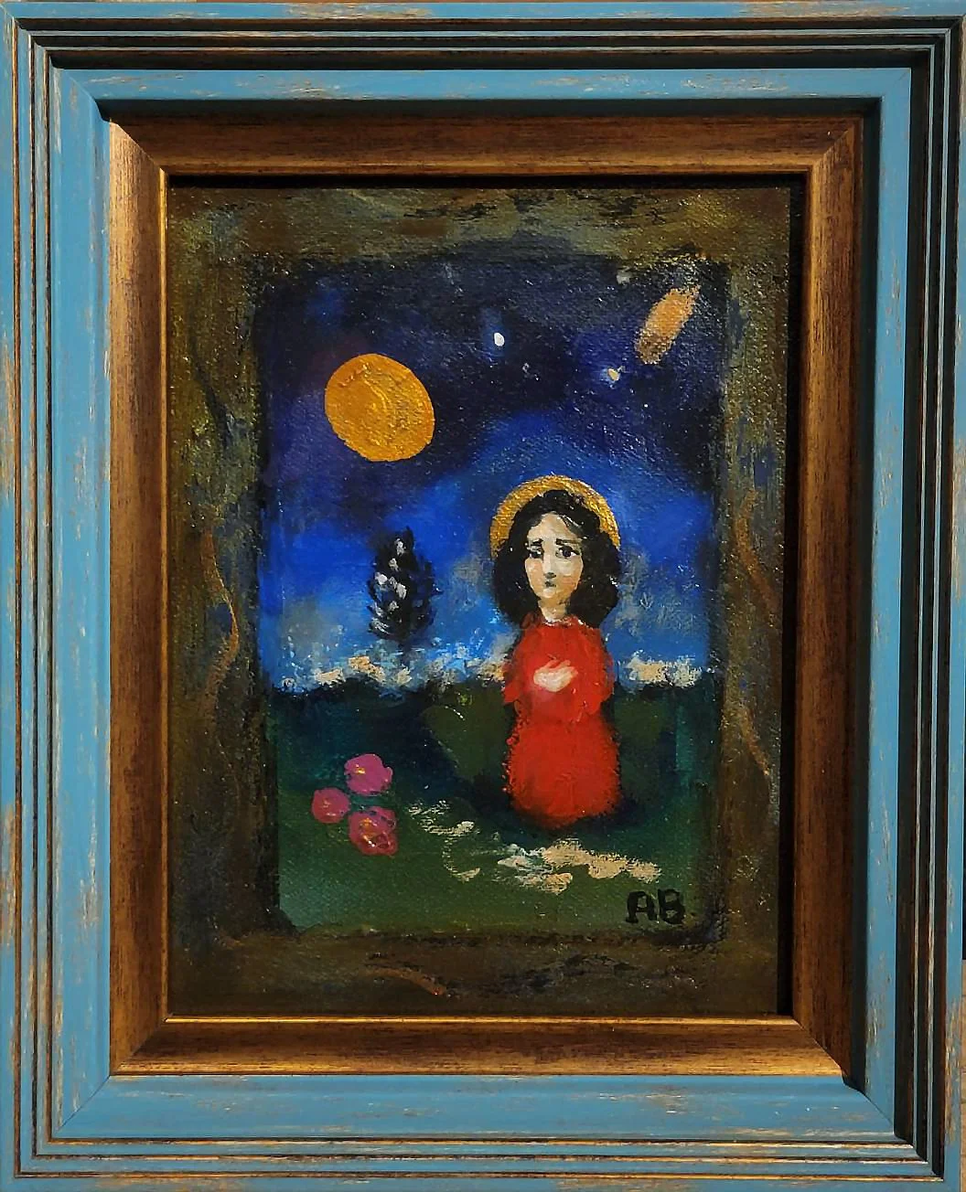 A painting of a figure in a red dress with dark hair, standing outdoors at night with a starry sky, a large yellow moon, and a ship in the distance, framed in a wooden frame painted in shades of blue.