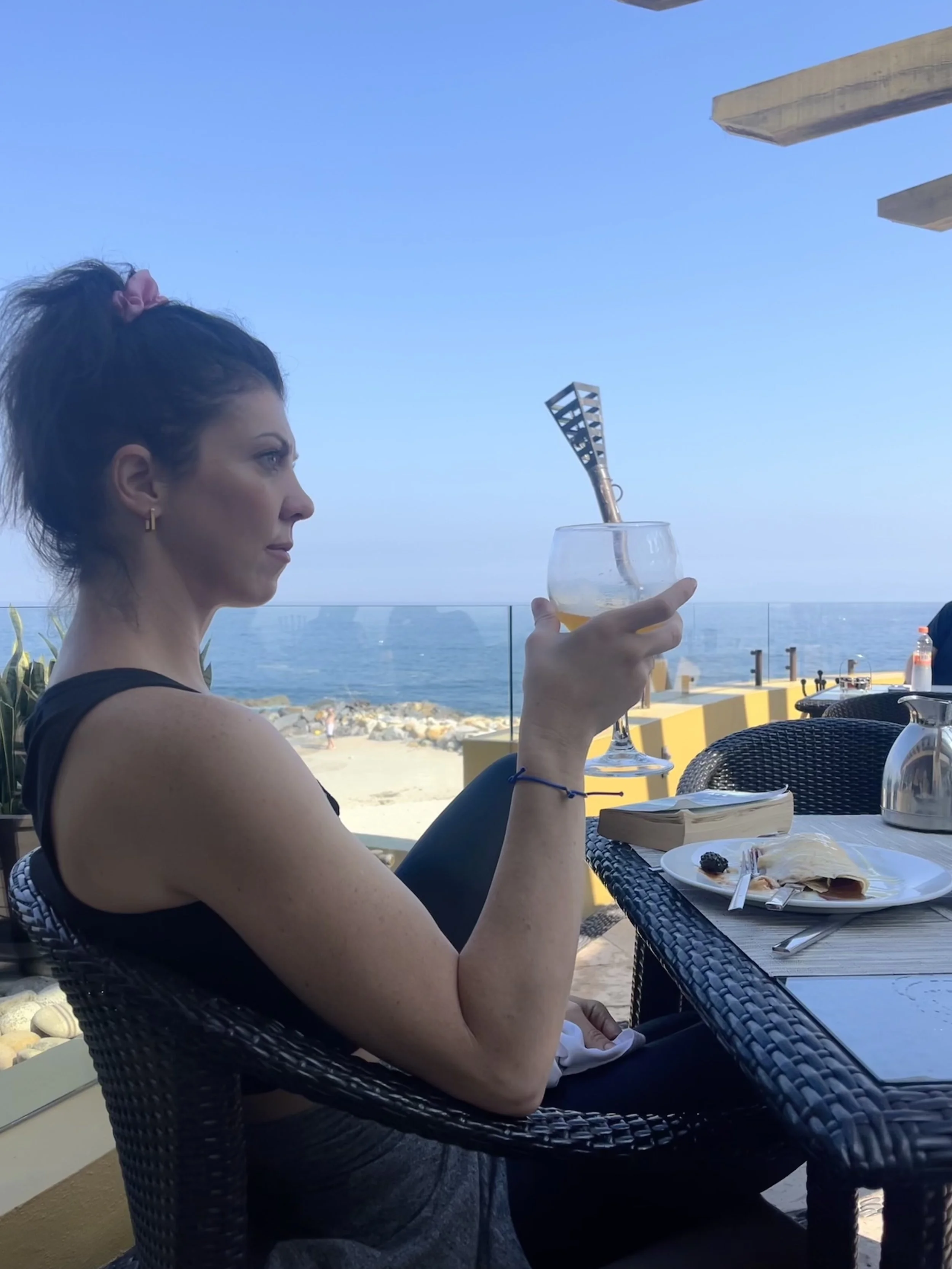 woman looking out over ocean