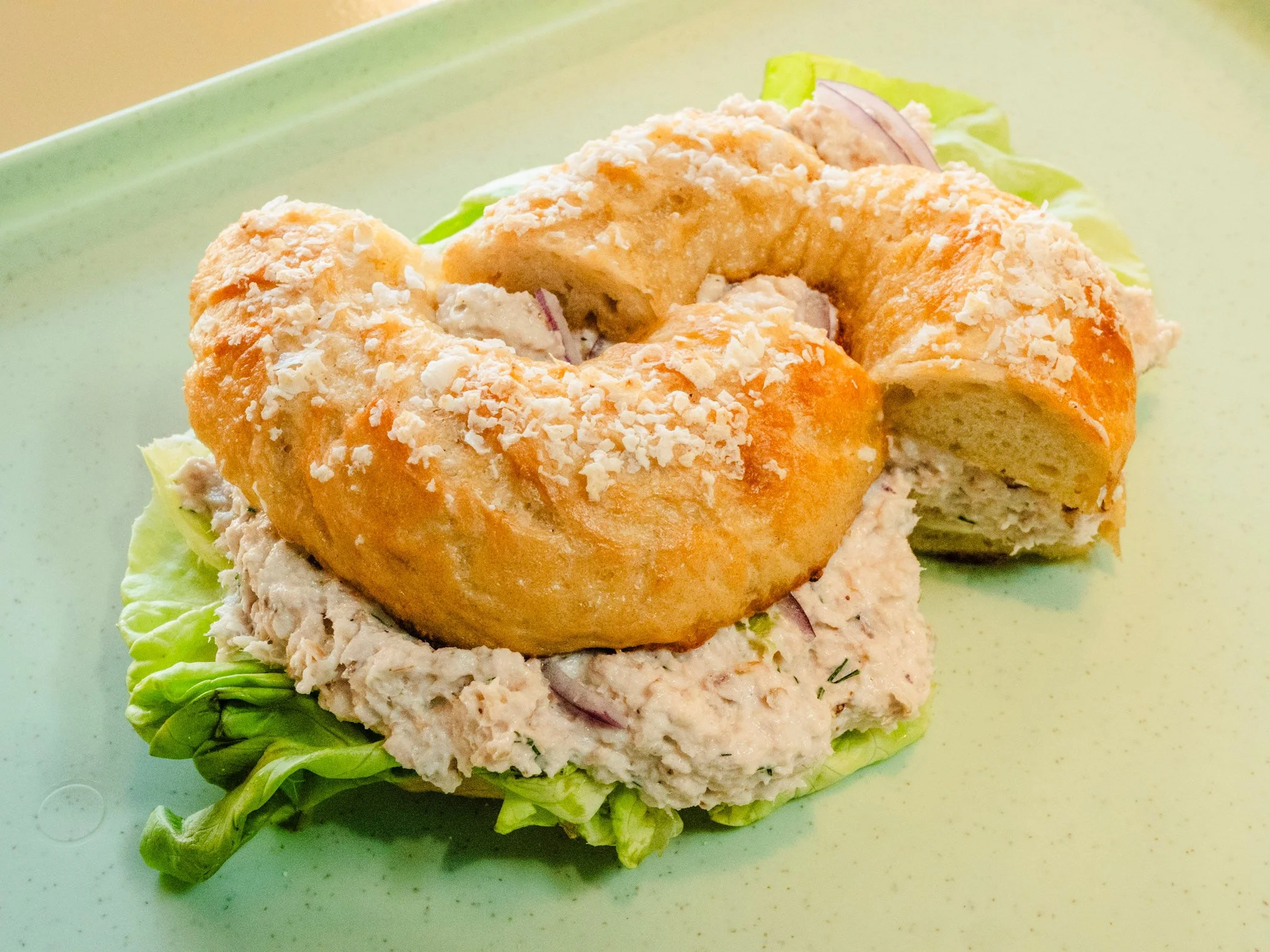 A creamy bagel stacked with lox and toppings.