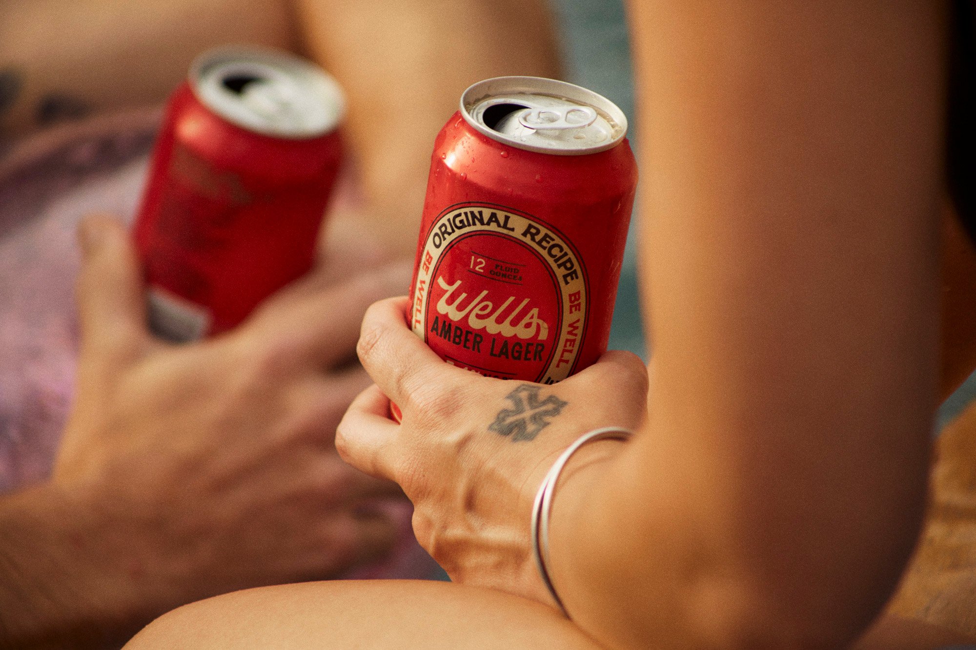 An ice cold Wells Pale Lager can you can buy and enjoy in-house or take to go in a 12 pack.