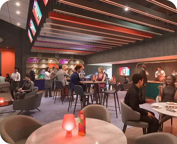 A lively bar and lounge with people socializing, drinking, and dining. Modern decor with illuminated shelving, colorful backlit panels, and a sleek ceiling design.