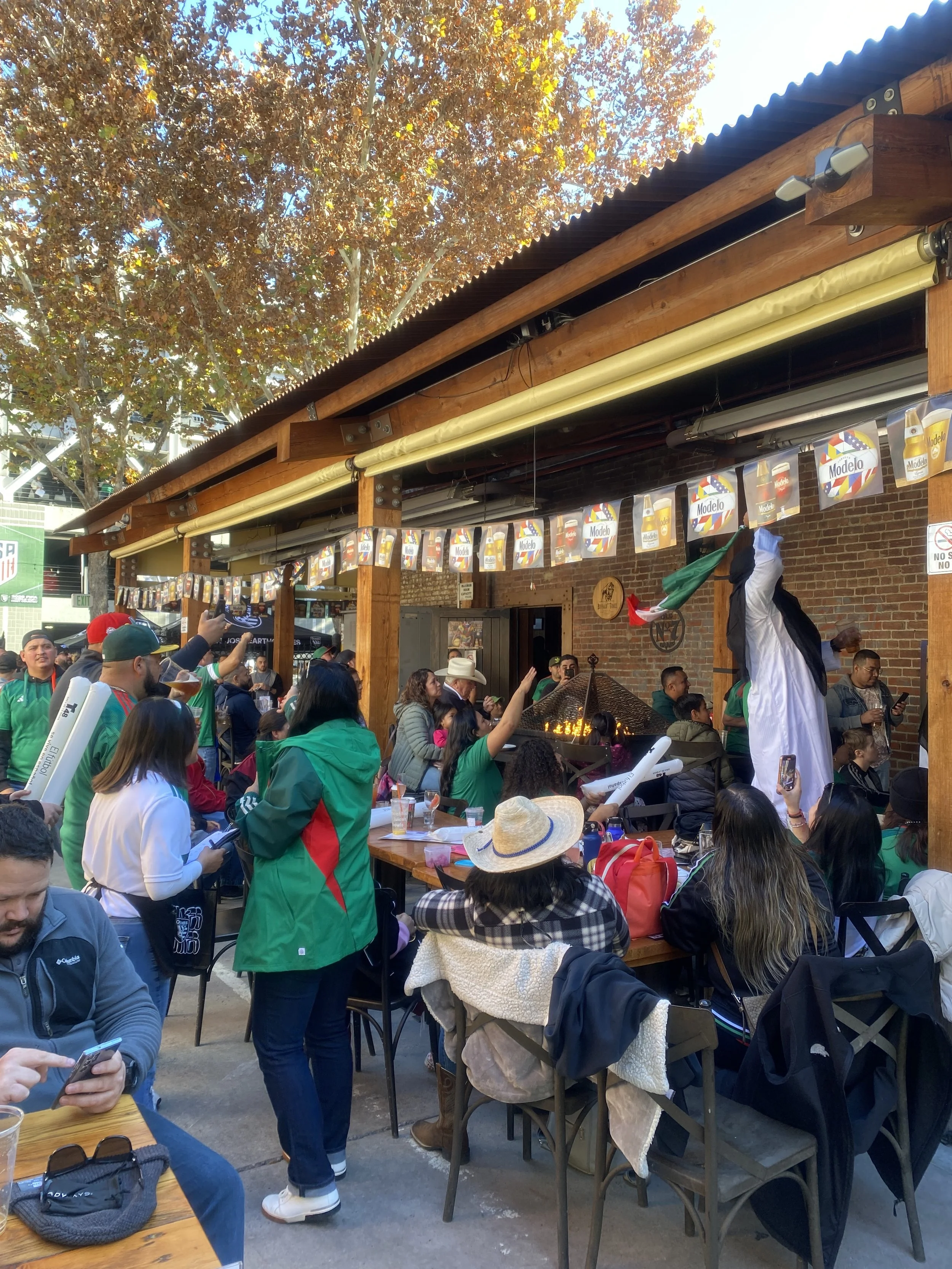 Mexico fans watching a soccer match in San Pedro Square