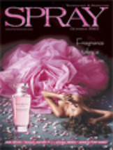 A magazine cover with the title "SPRAY" and the subtitle "Euphoria". The cover features a woman lying down, surrounded by pink smoke and confetti, with a spray bottle of perfume nearby.