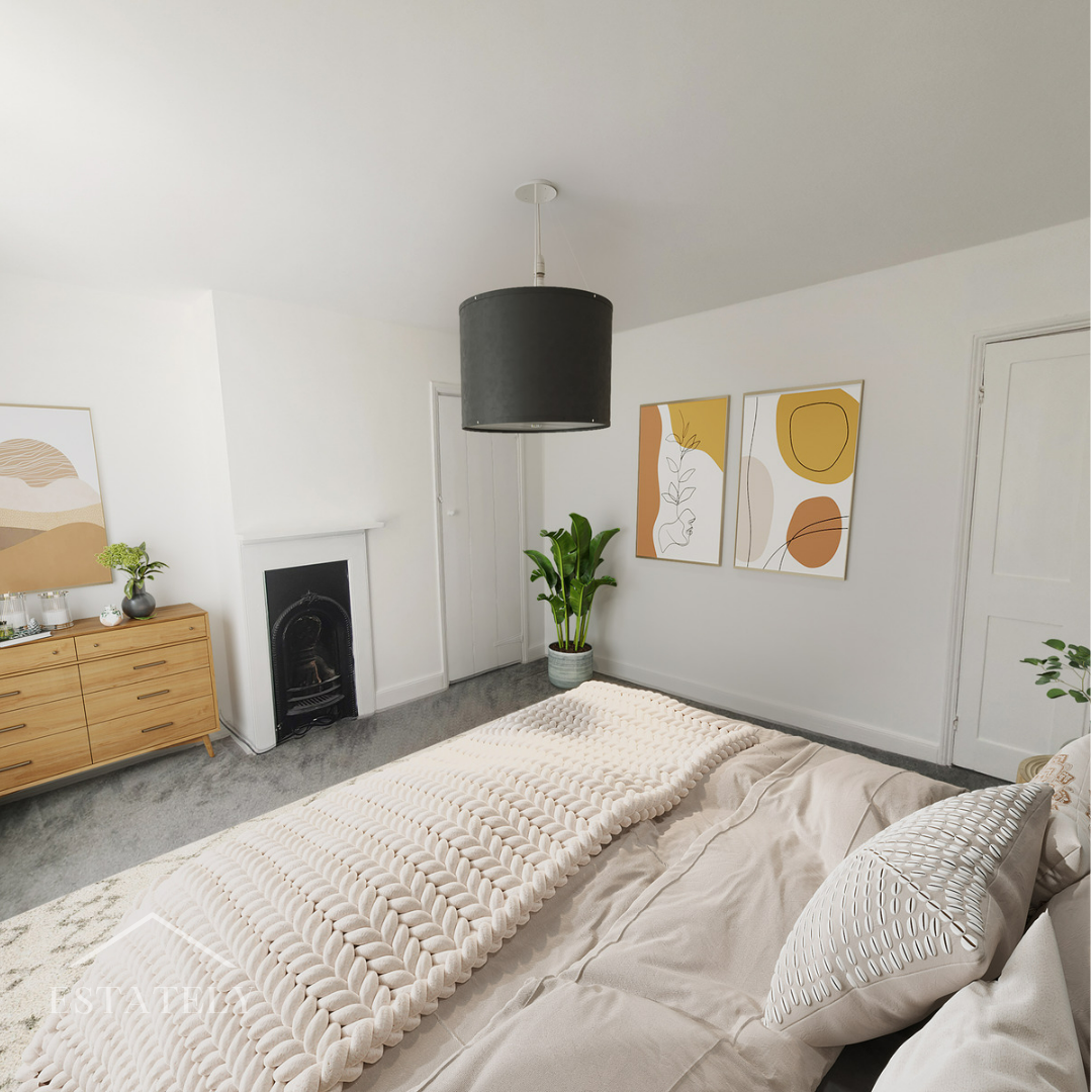 Minimalist modern bedroom with white walls, beige bedding, and abstract art on the wall. There is a potted plant near the fireplace and a wooden dresser with a plant and decorative items. A black lampshade hangs from the ceiling.