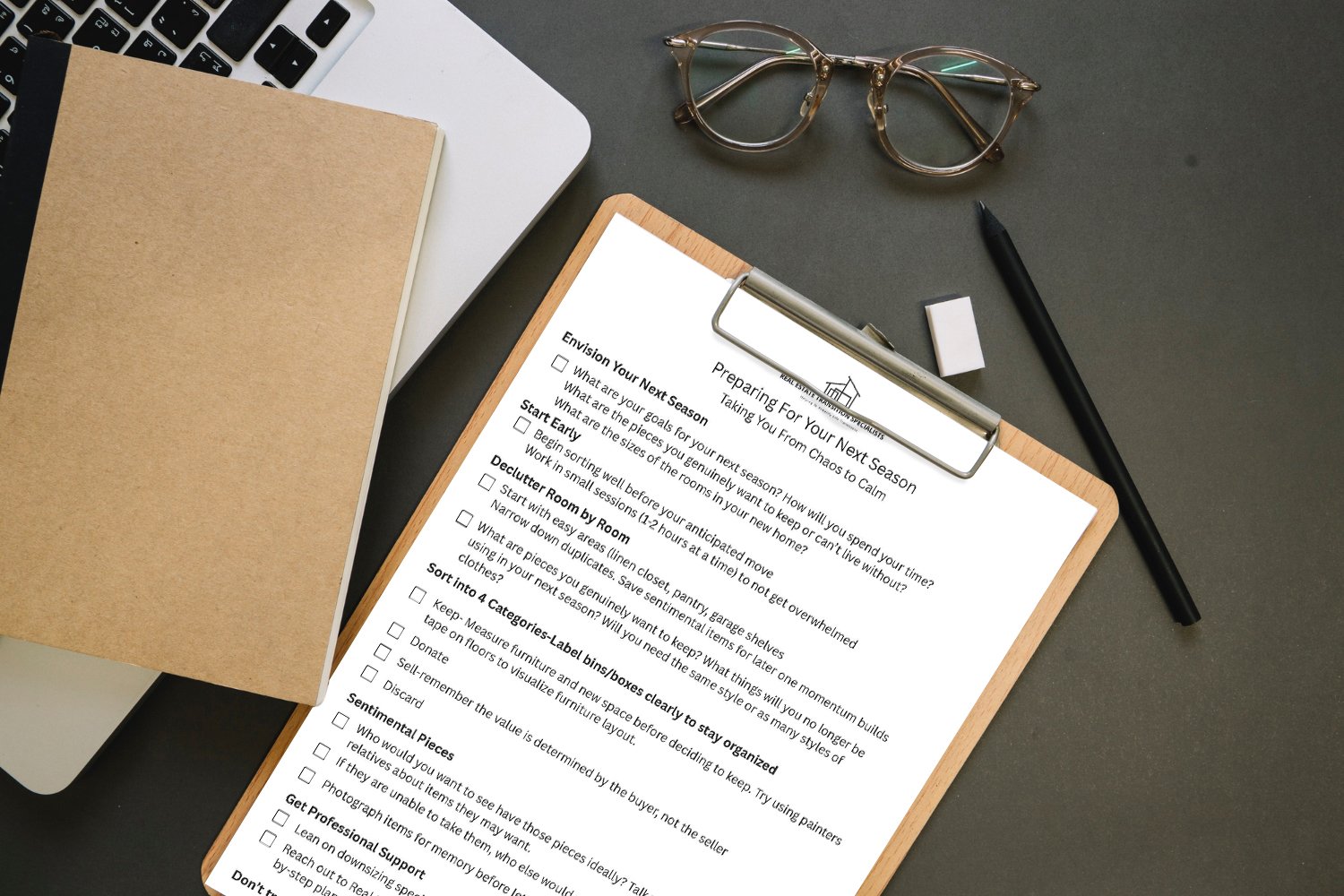 A clipboard with a checklist titled 'Preparing For Your Next Season' on a desk. The list includes steps like envisioning goals, starting early, decluttering, sorting, and organizing. Nearby are glasses, a black pen, an eraser, a notebook, and a laptop.