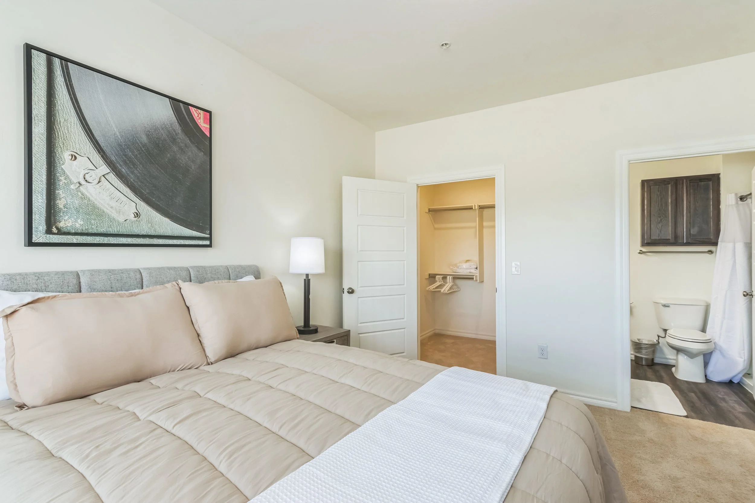 Additional private bedroom in multi-bedroom corporate housing suite.