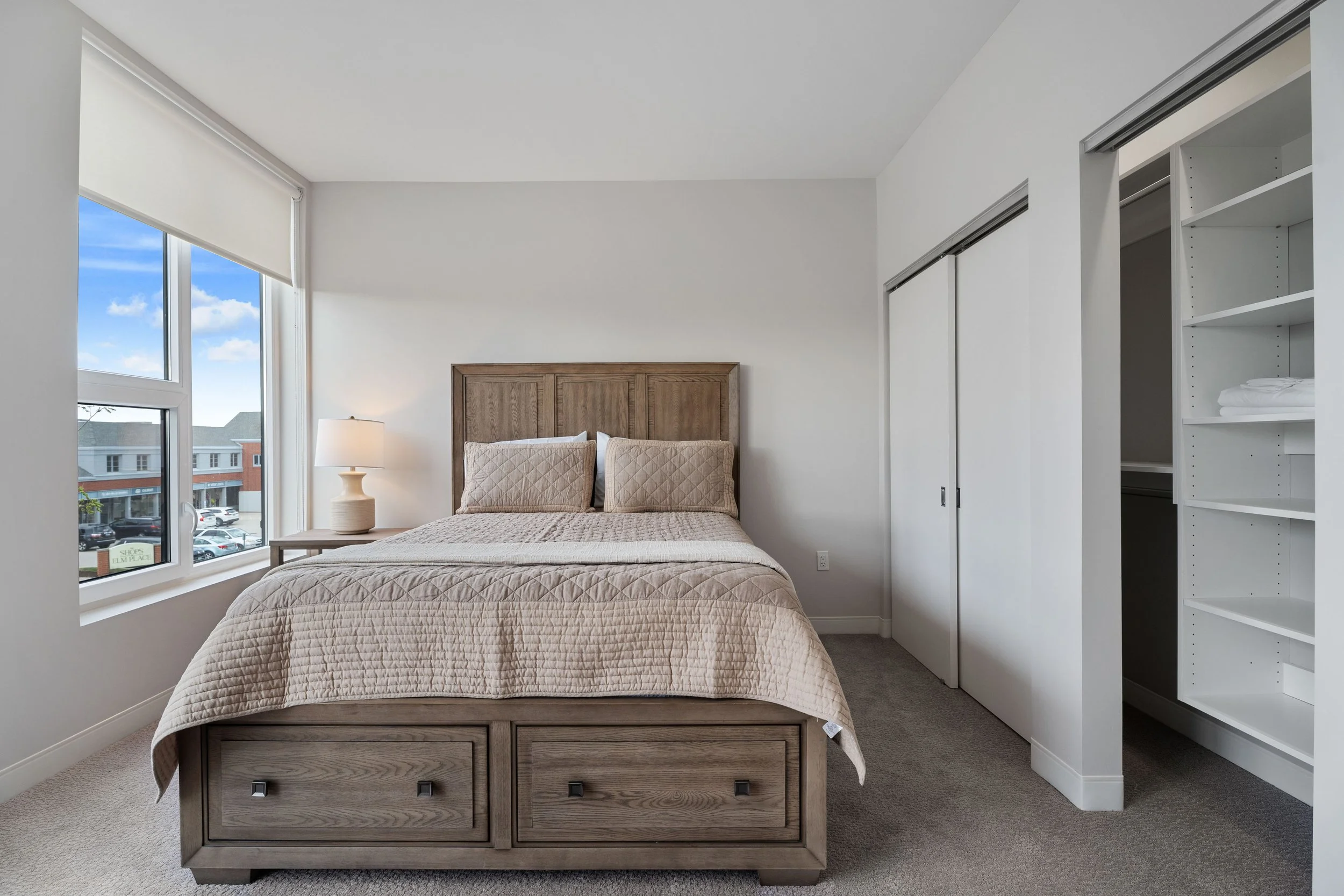 Furnished bedroom in corporate apartment designed for business travelers.