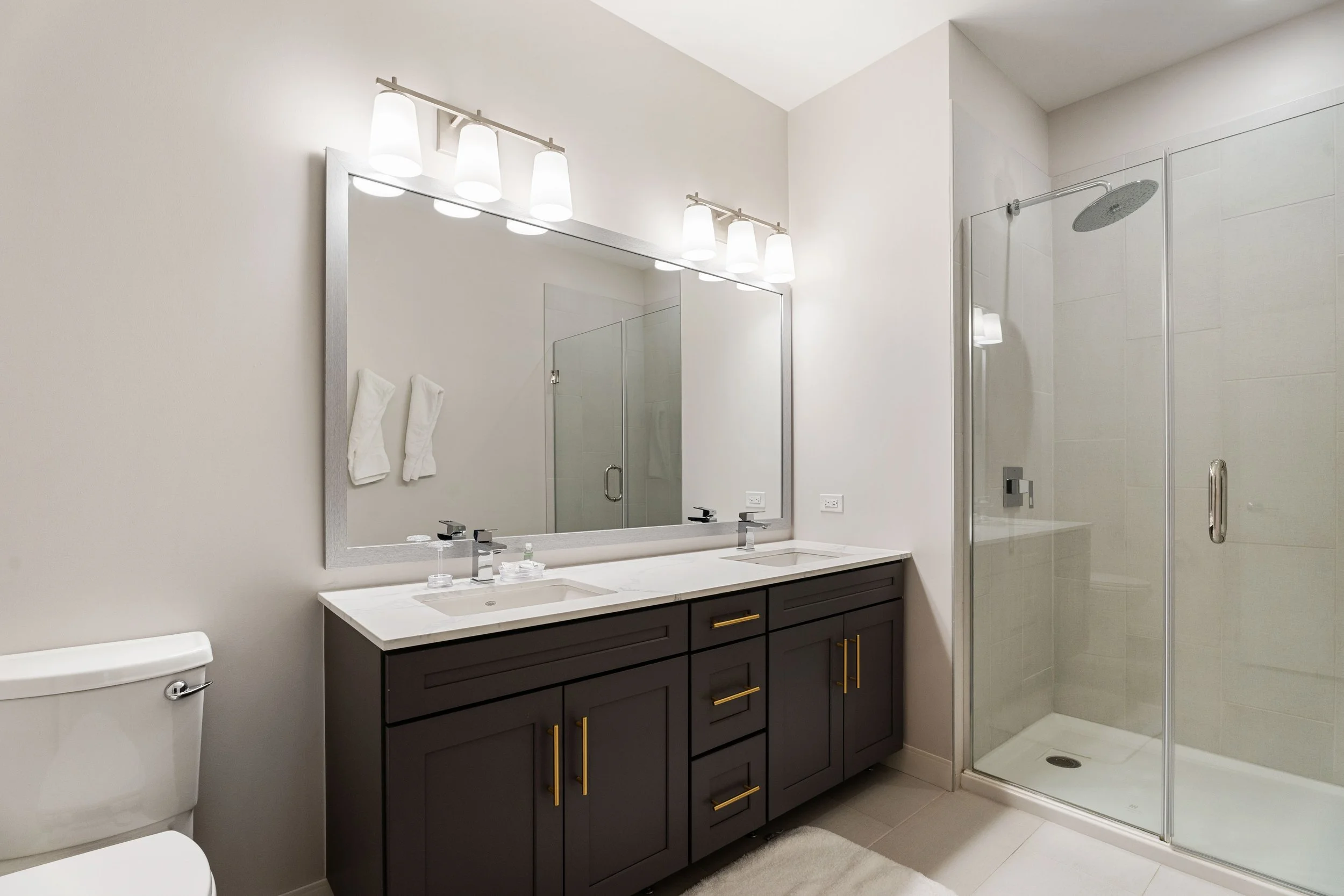 Corporate housing bathroom and private suite layout designed for long-term commercial projects.