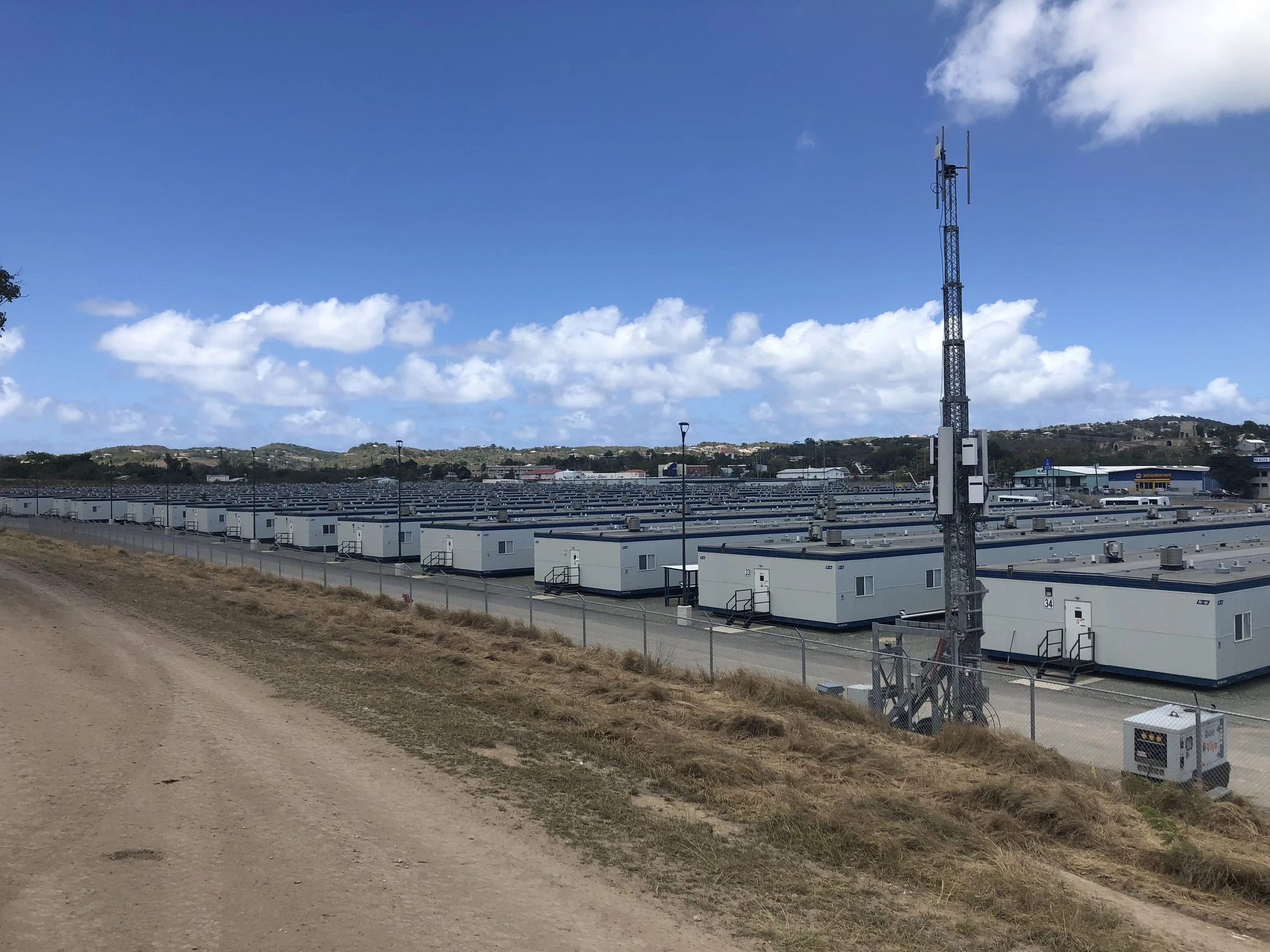 Remote-site modular housing structure offering private rooms and crew lodging.