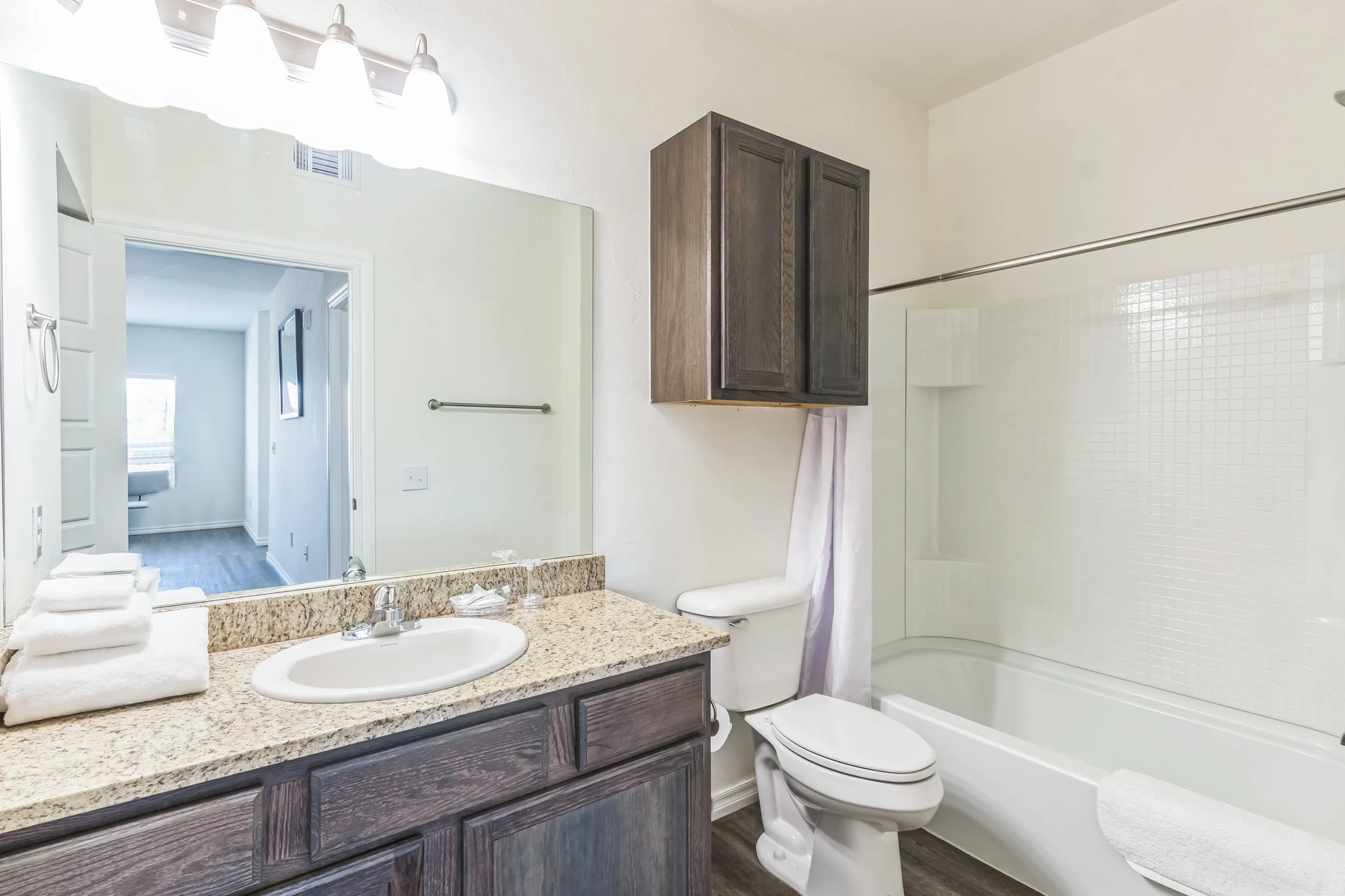Corporate housing bathroom and private suite layout designed for long-term commercial projects.