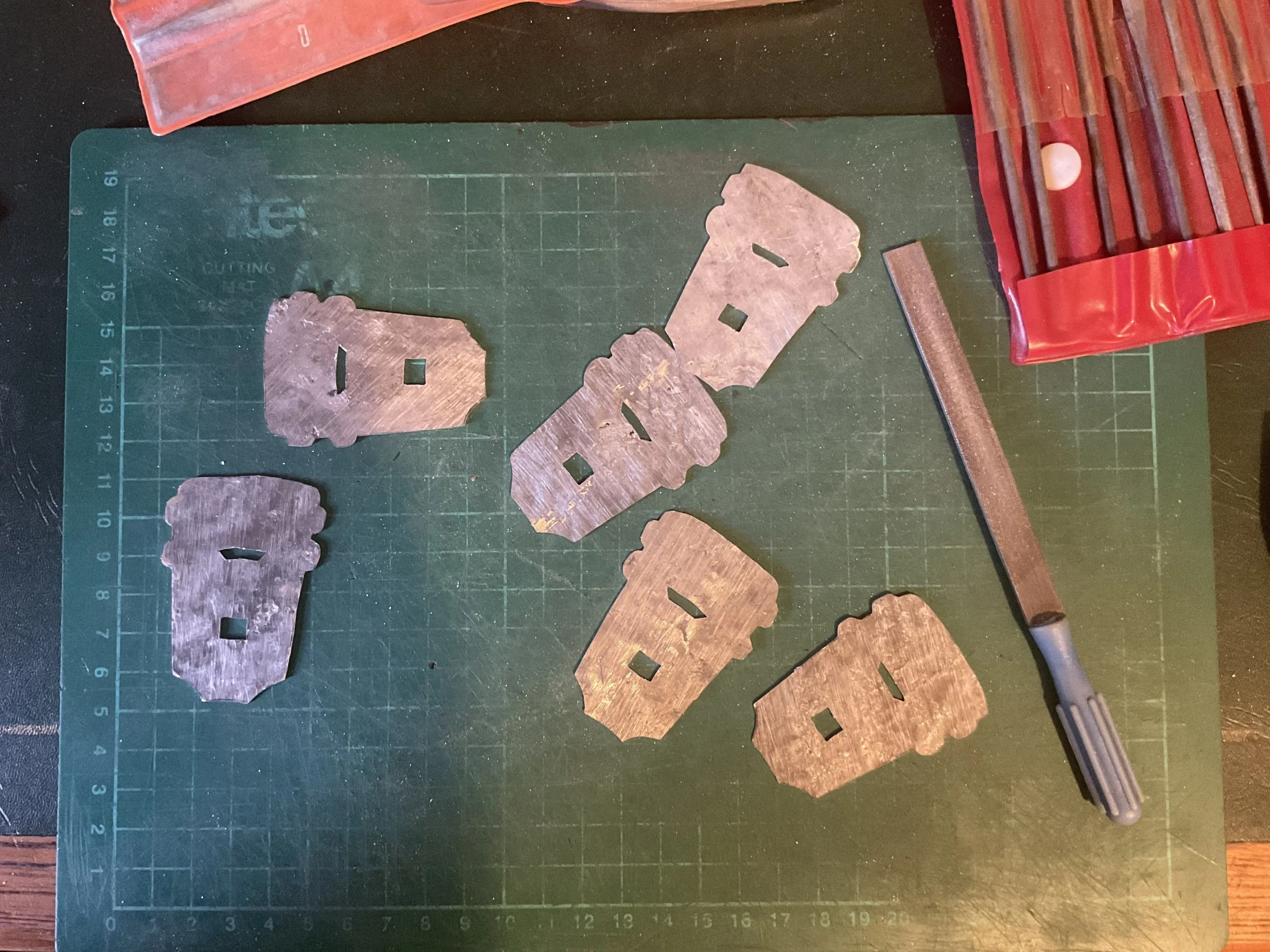 Some cut and pierced badges.