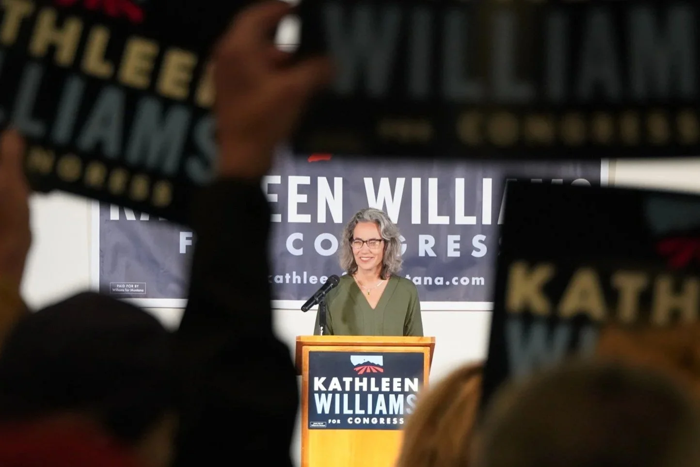 Kathleen Williams was candidate for Congress, smiling as she addresses an audience.