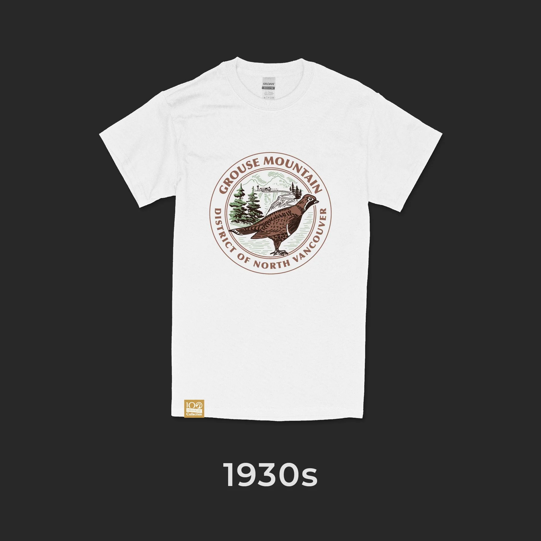 A white T-shirt with a vintage-style graphic of a grouse bird, trees, and mountains, and text reading 'Grouse Mountain District of North Vancouver', from the 1930s.