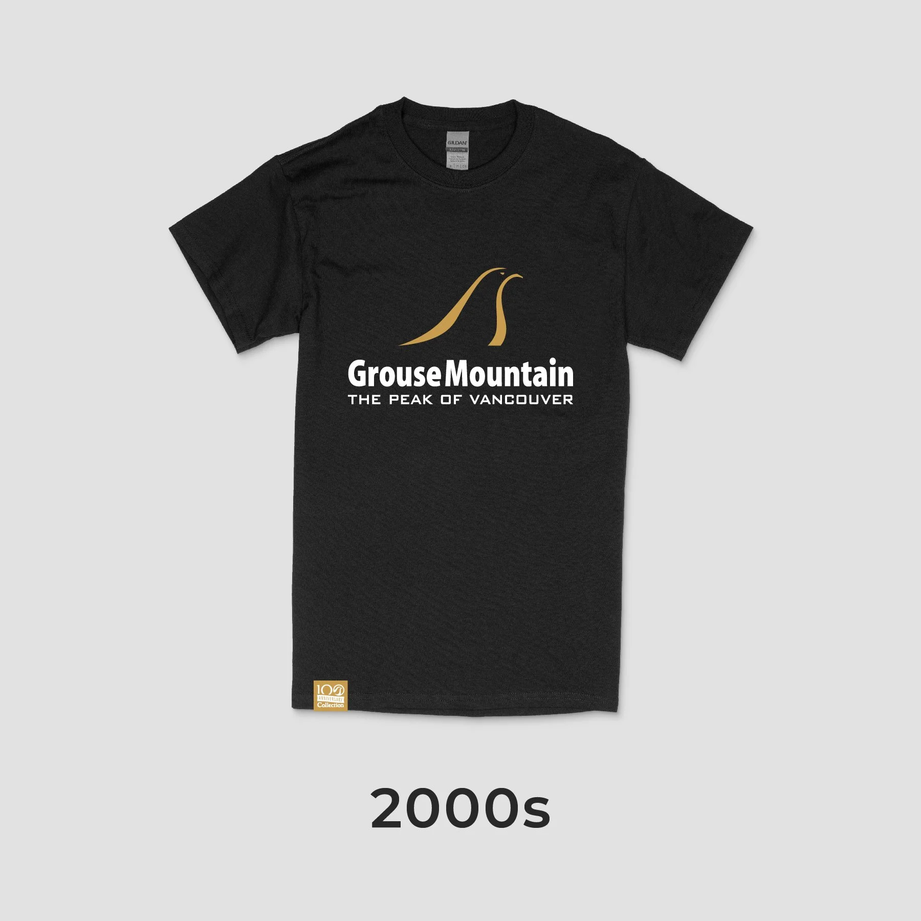 Black T-shirt with a gold and white graphic design reading 'Grouse Mountain - The Peak of Vancouver' and a stylized mountain logo, labeled as from the 2000s.