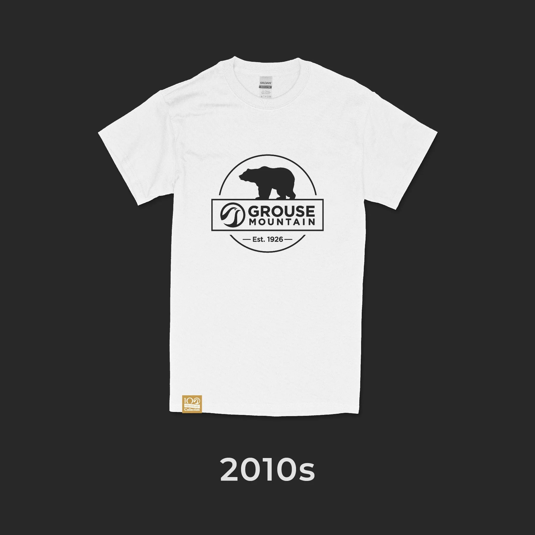 White T-shirt featuring a black bear silhouette, a circular logo with a mountain and eagle head, and the text 'GROUSE MOUNTAIN Est. 1926'; 2010s era