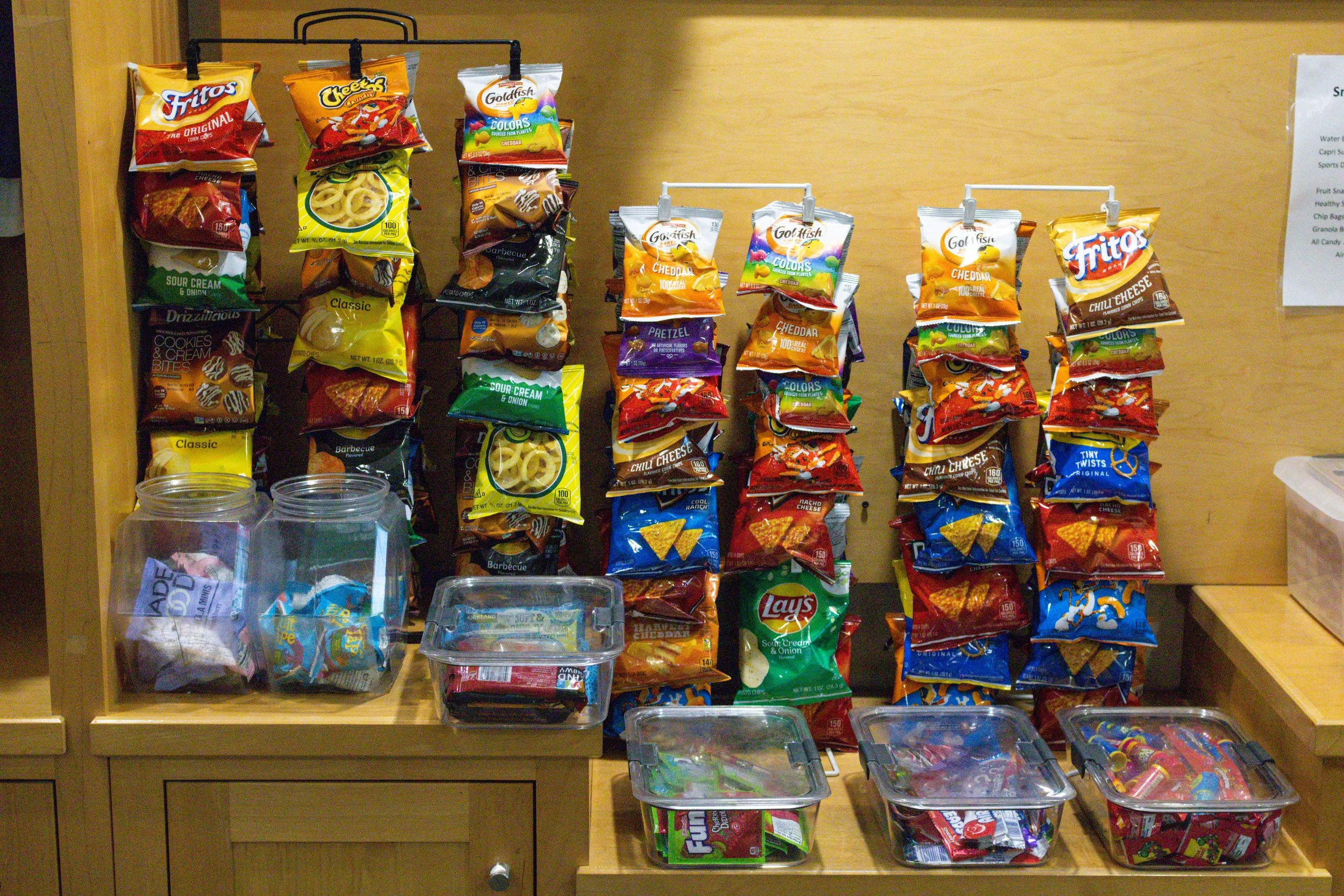 Snack selection available at Westport Tennis Club pro shop, including chips, Goldfish, and grab-and-go treats for players.