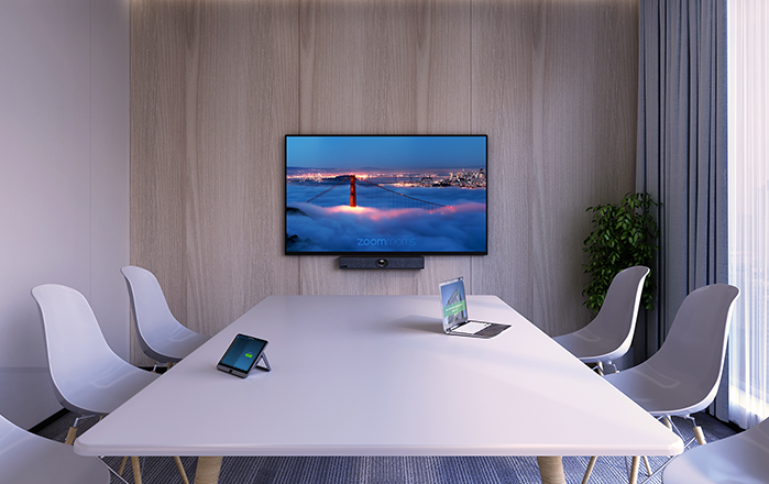 Modern conference room with a wall-mounted TV and a Zoom room solution