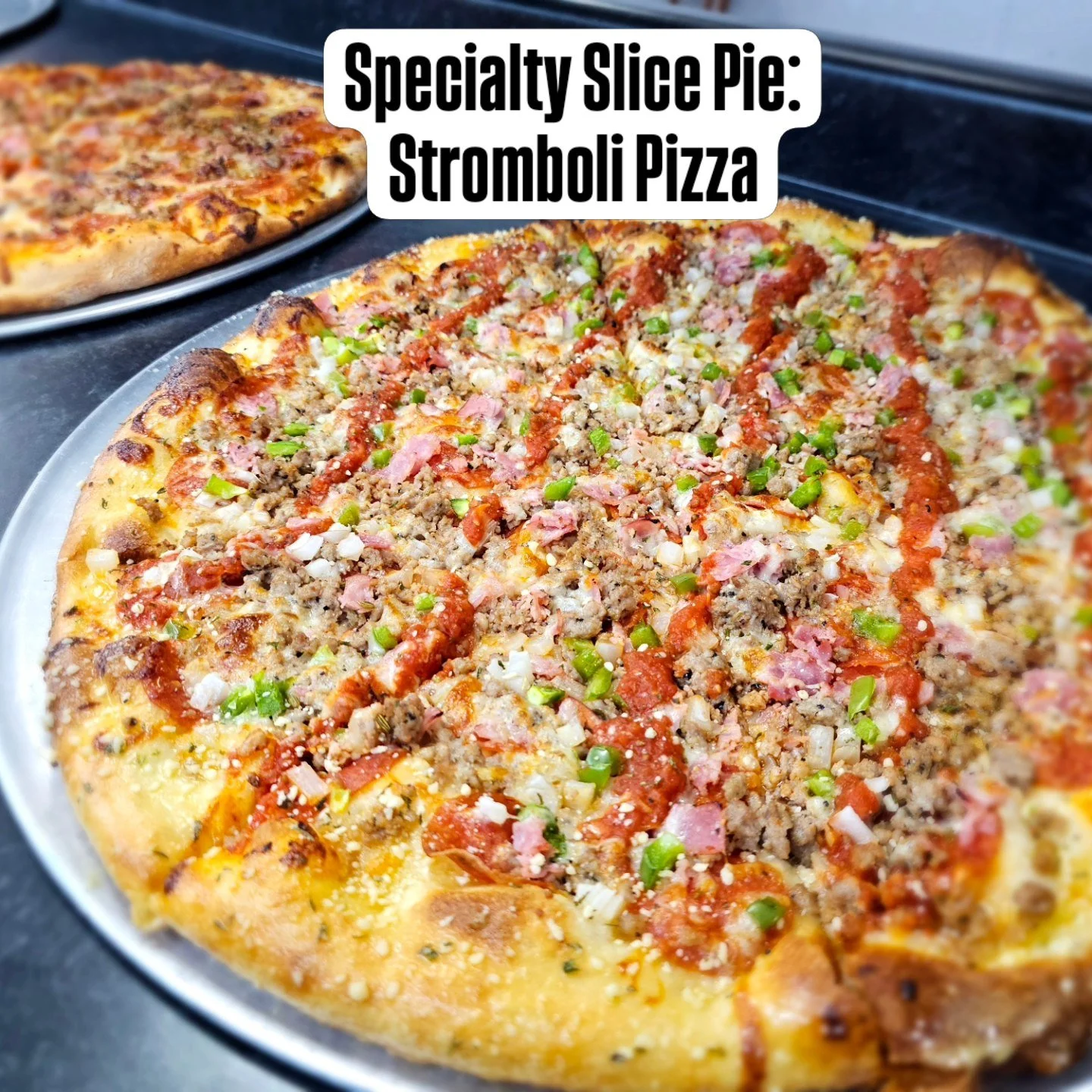 Stromboli Pizza; Garlic Butter Base, Pepperoni, Sausage, Ham, Green Peppers, Onion, Mozzarella Cheese, and Sauce Drizzled on top. 
