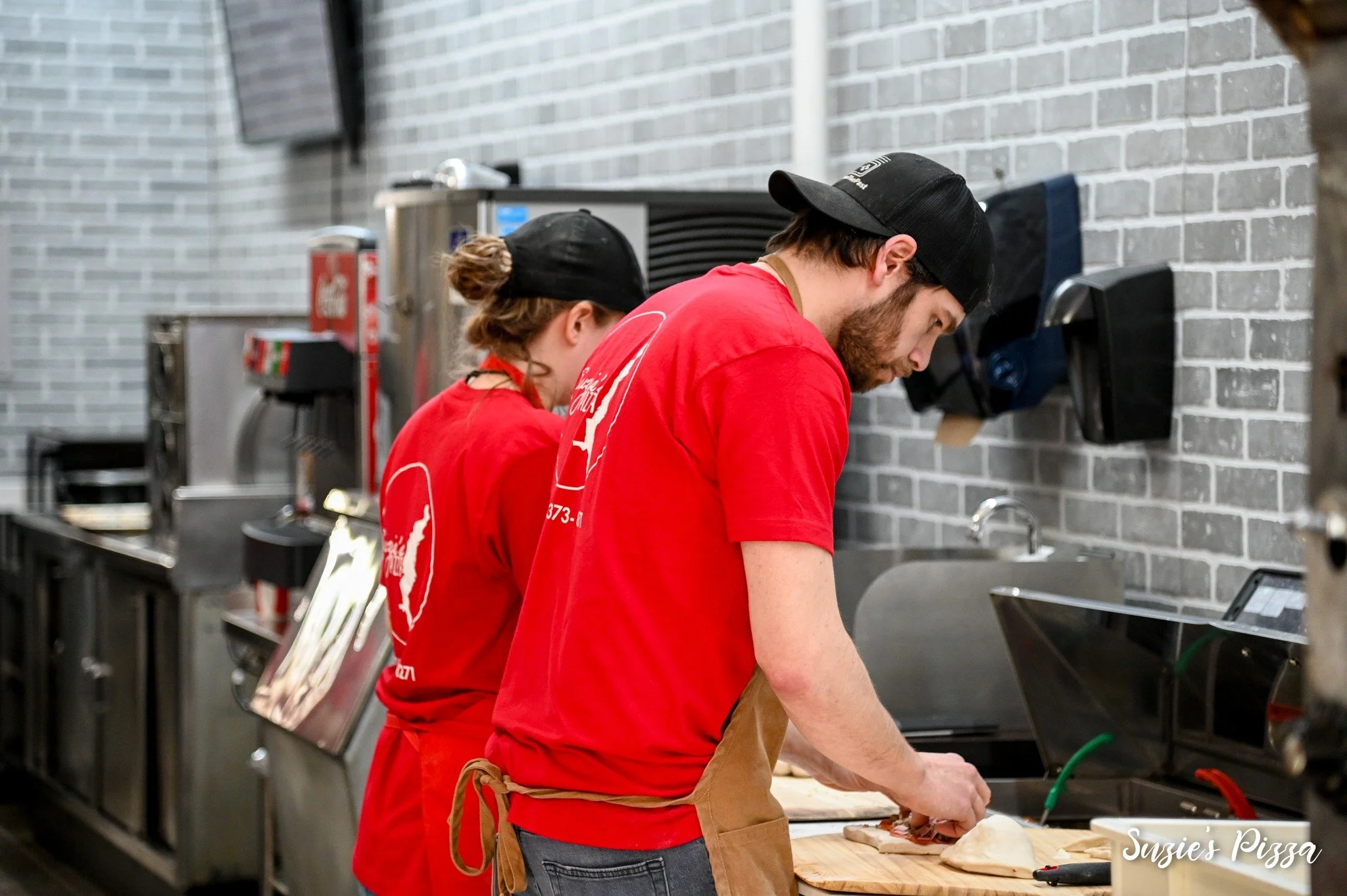 Troy and Suzie making Pizza